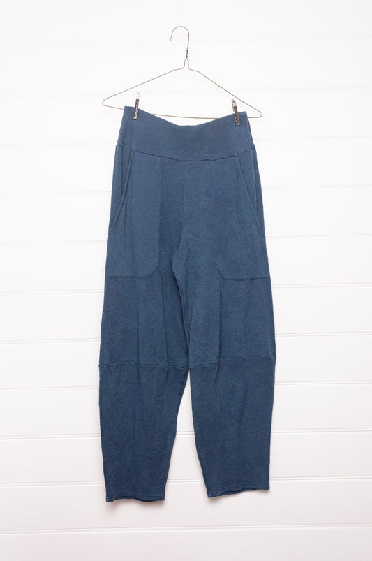 Valia merino wool jacquard knit travel pants in denim blue.