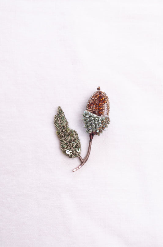 Trovelore hand embroidered and beaded acorn brooch.