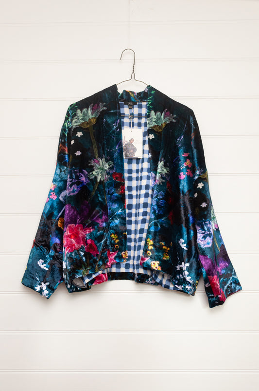 Yavi silk velvet kimono crop jacket in vibrant floral print on teal blue.