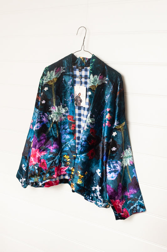 Yavi silk velvet kimono crop jacket in vibrant floral print on teal blue.