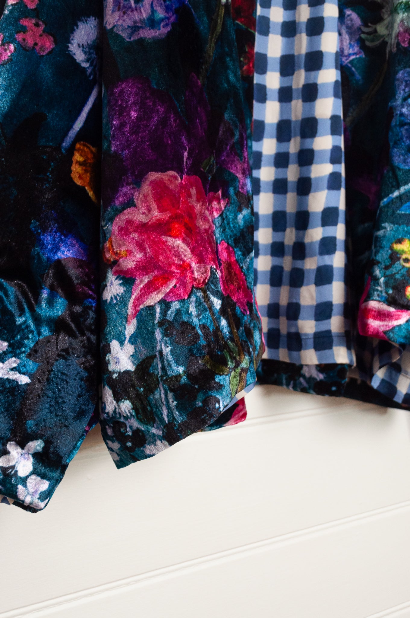 Yavi silk velvet kimono crop jacket in vibrant floral print on teal blue.