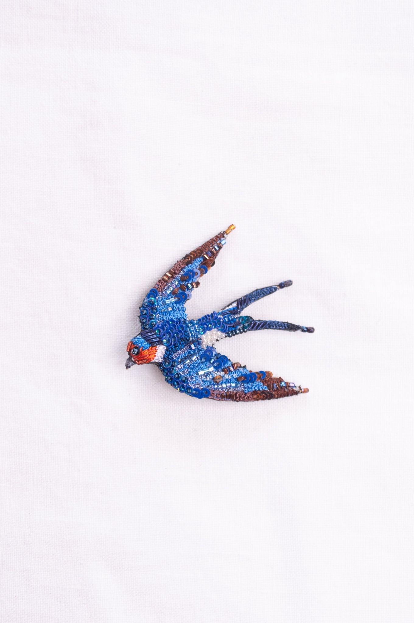 Trovelore hand embroidered and beeded Flying swallow brooch.