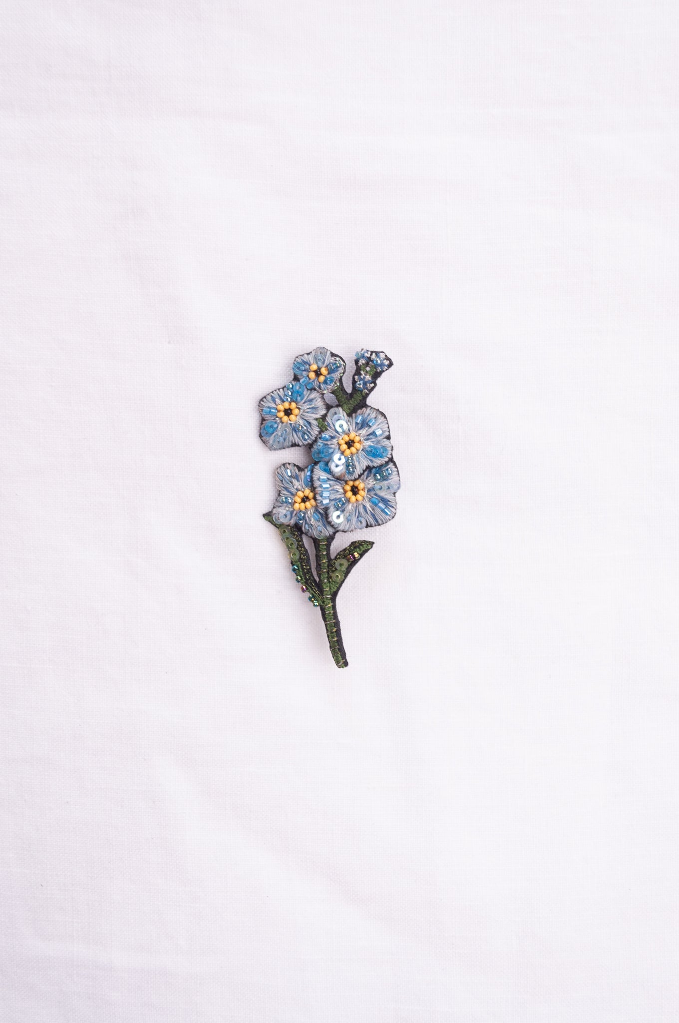 Trovelore hand embroidered and beaded Forget-me-not brooch.