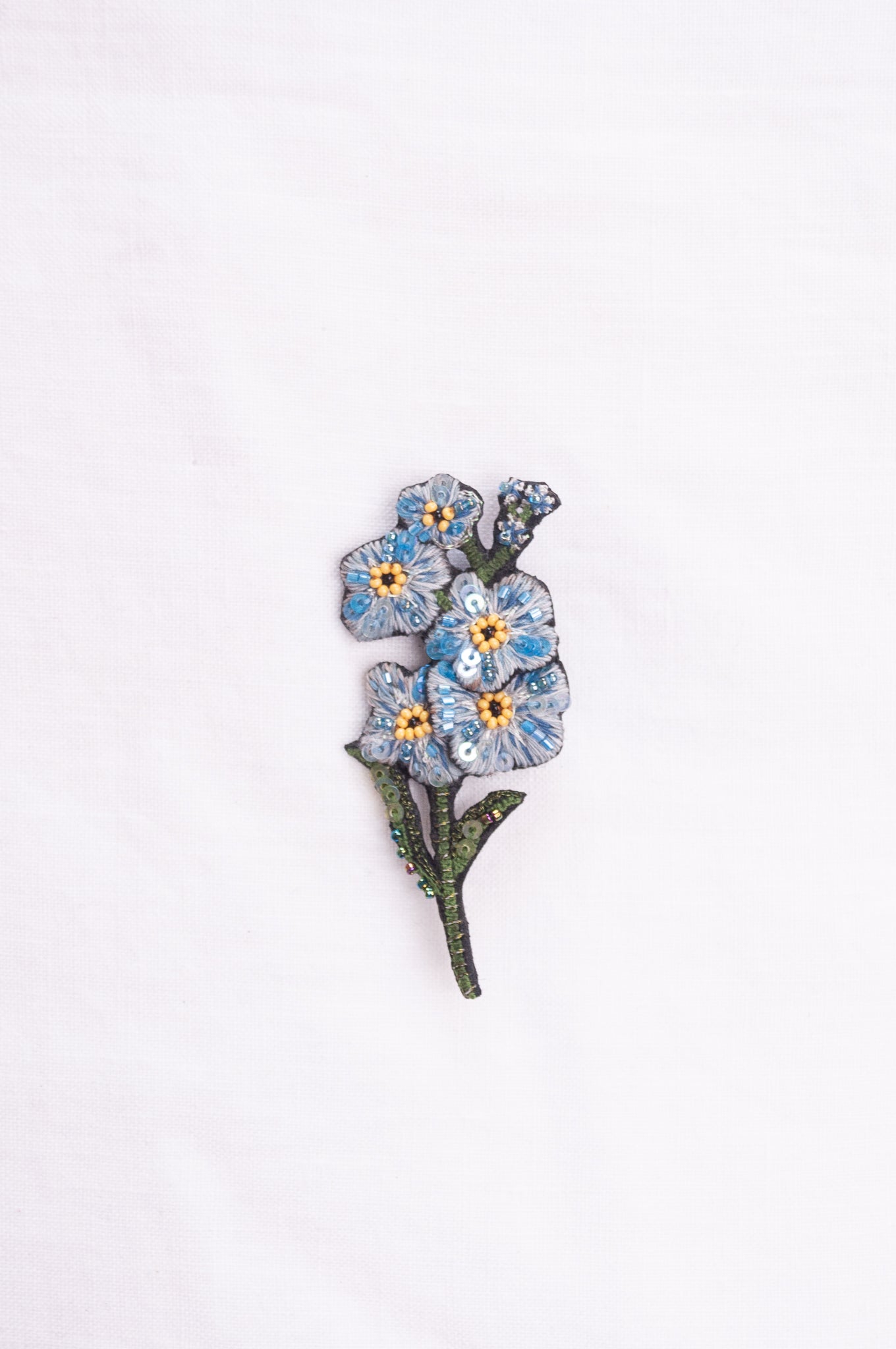 Trovelore hand embroidered and beaded Forget-me-not brooch.