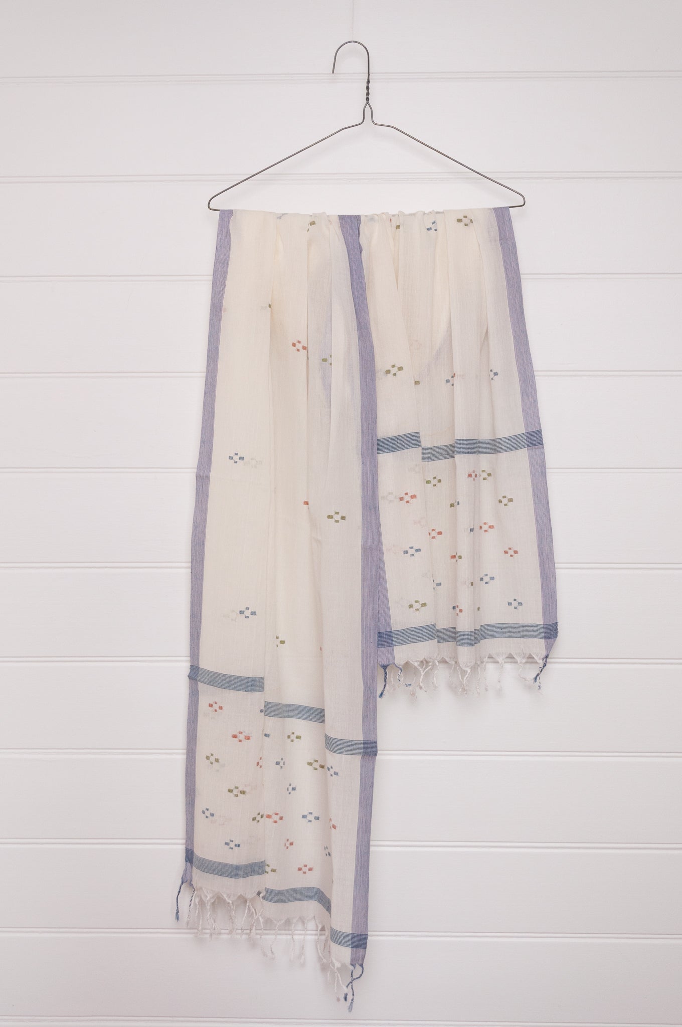 Handwoven light cotton jamdani scarf in ecru with multi-coloured motifs.