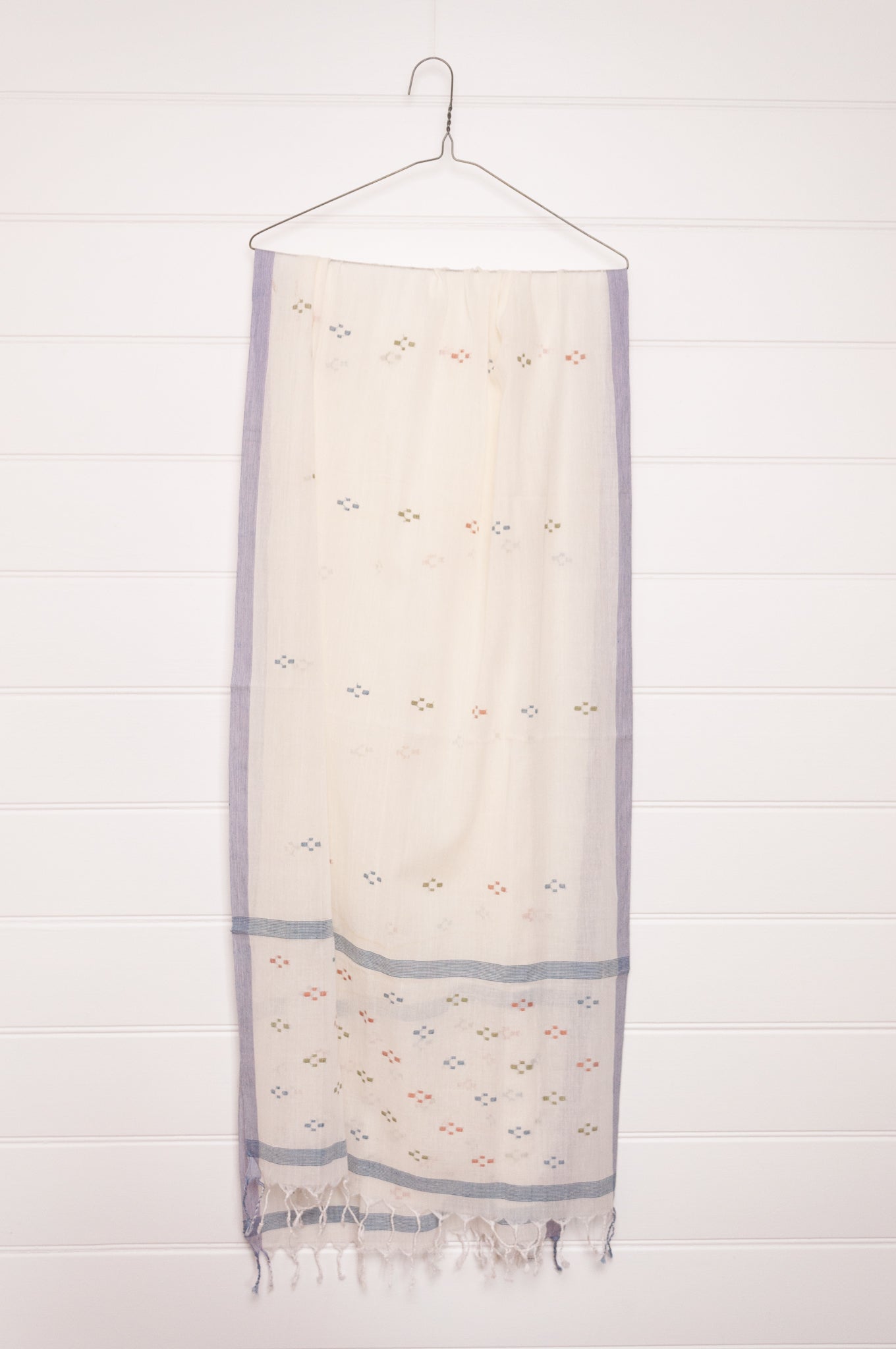 Handwoven light cotton jamdani scarf in ecru with multi-coloured motifs.