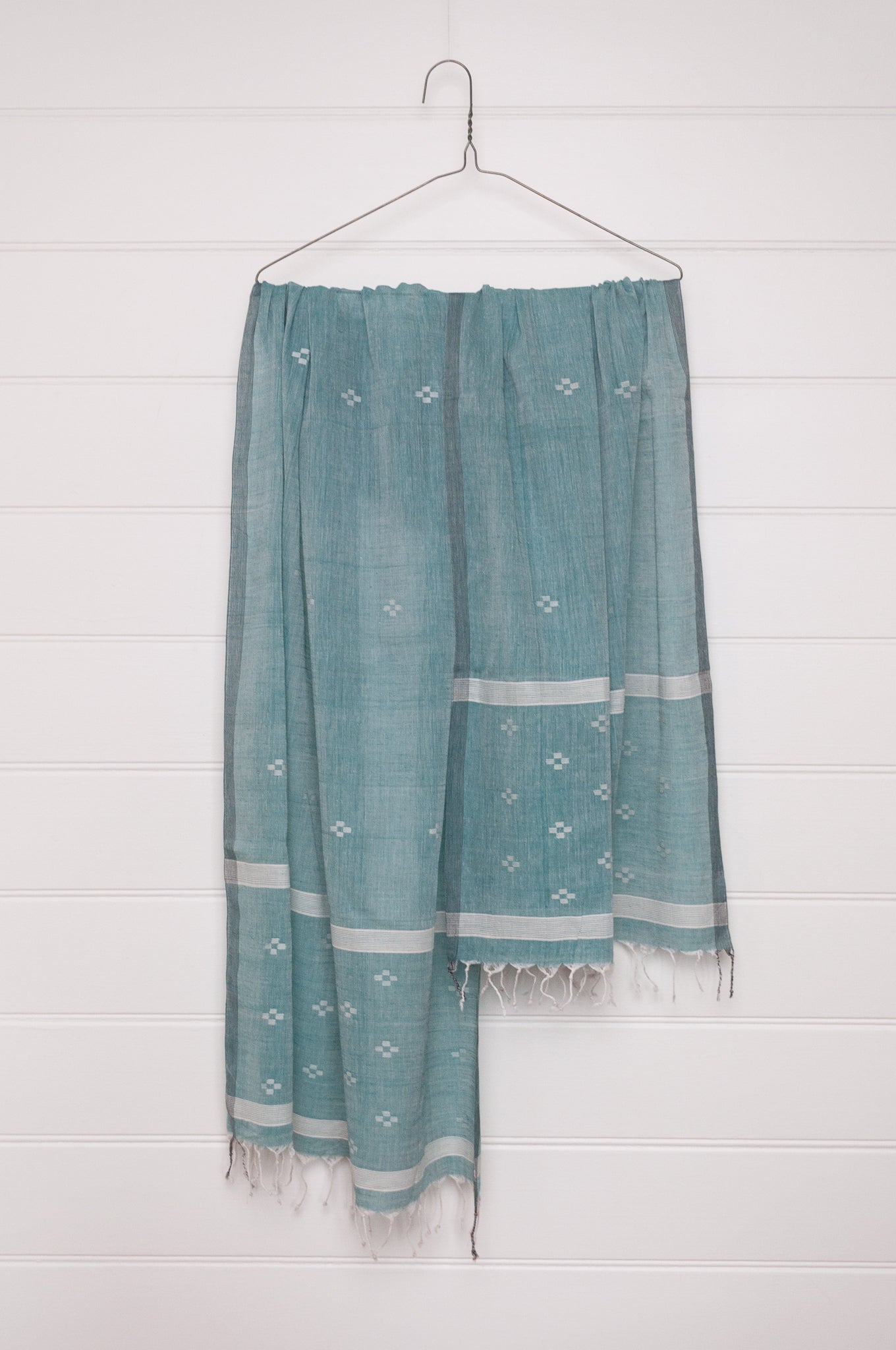 Handwoven light cotton jamdani scarf in light emerald green and white.