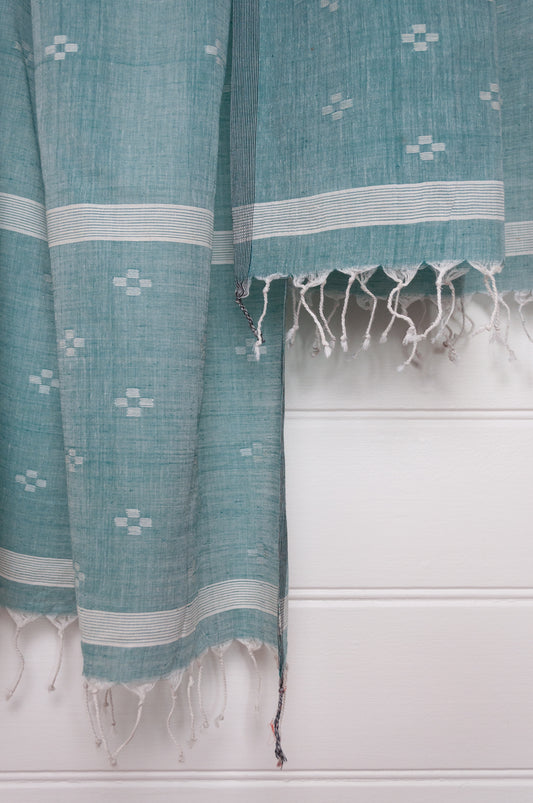 Handwoven light cotton jamdani scarf in light emerald green and white.