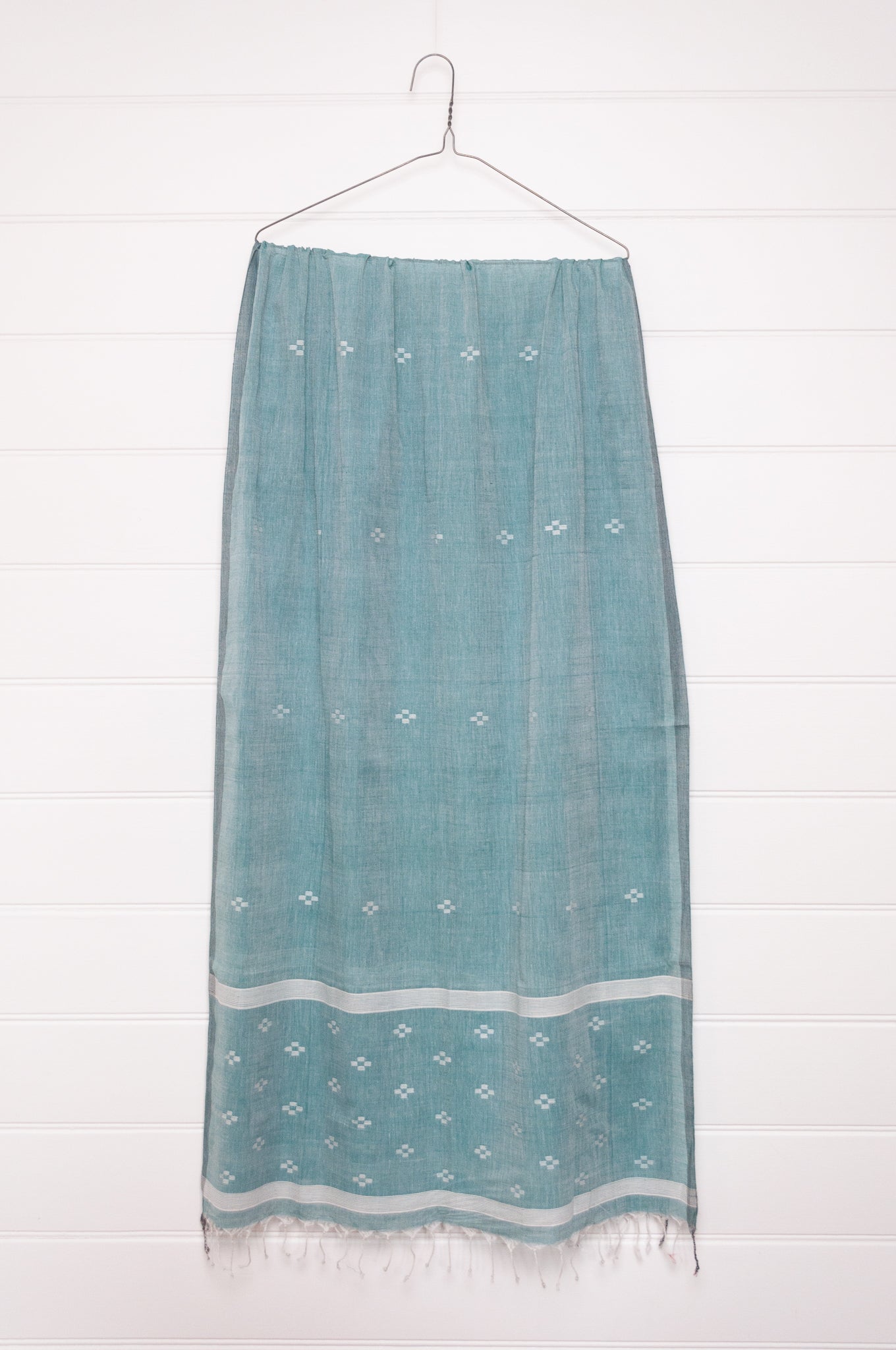 Handwoven light cotton jamdani scarf in light emerald green and white.