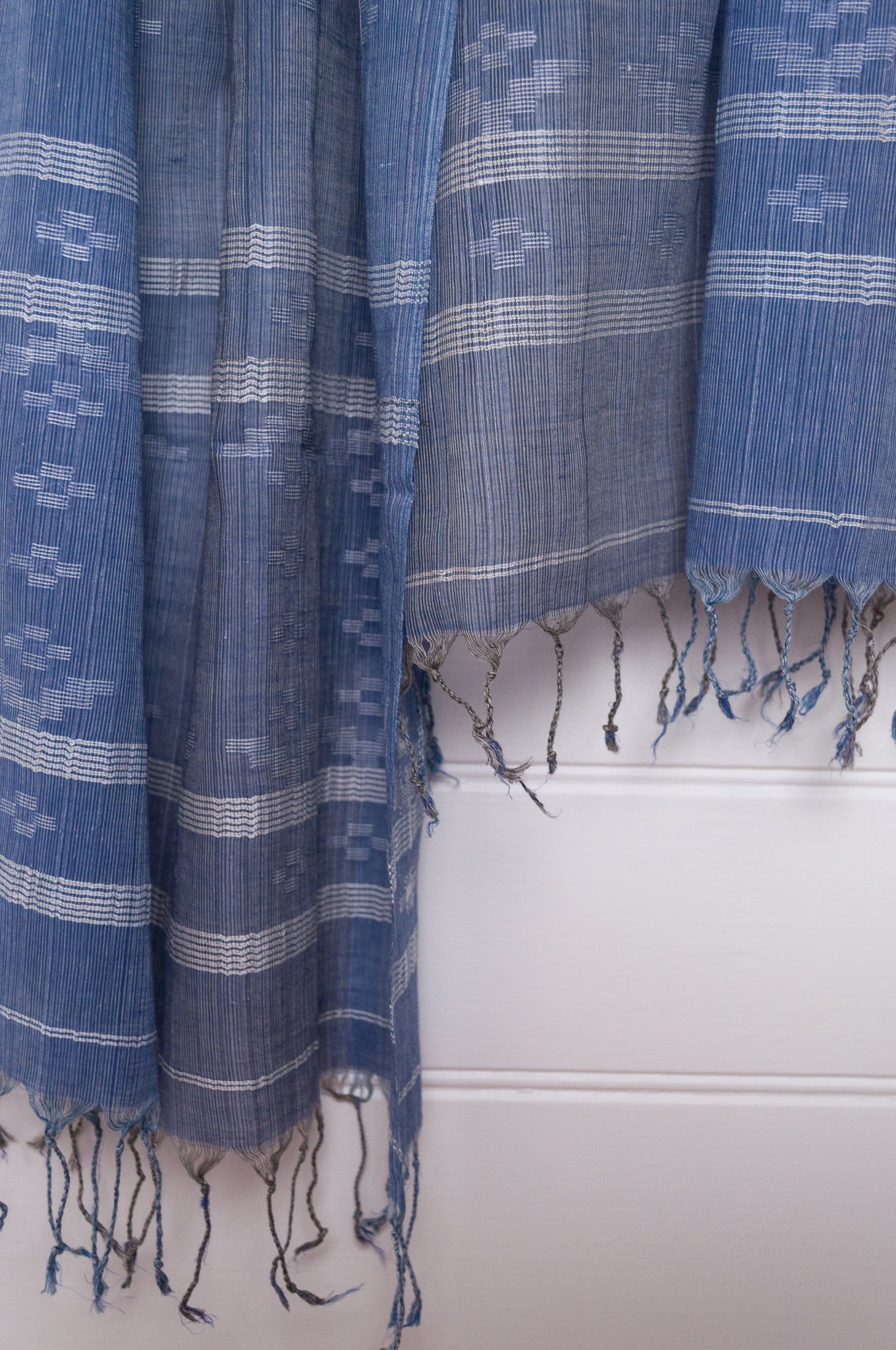 Handwoven light cotton  indigo panelled jamdani scarf with stripes and motifs in white.