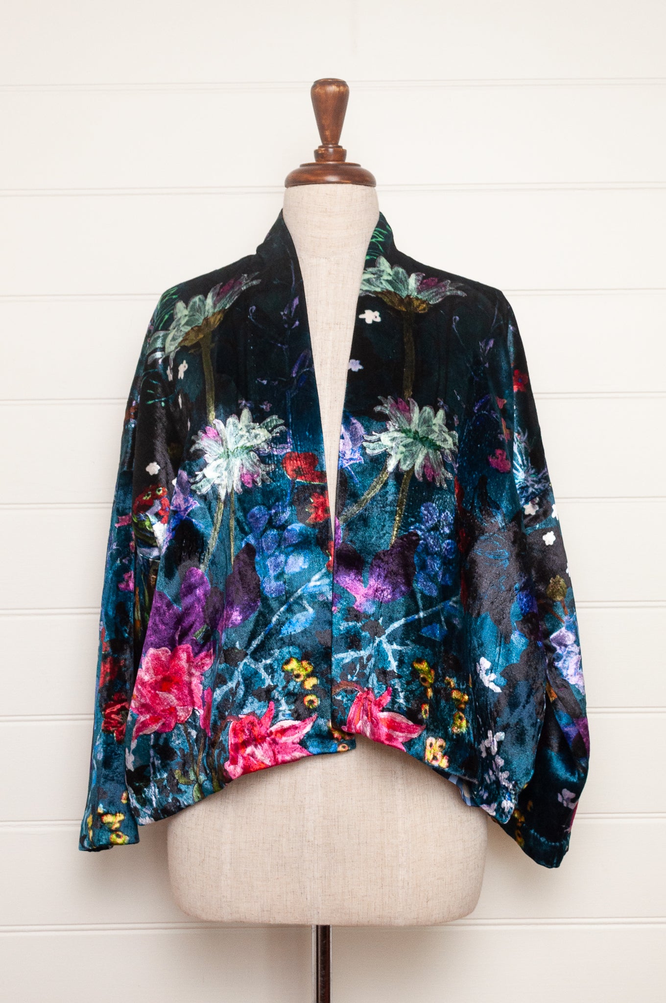Yavi silk velvet kimono crop jacket in vibrant floral print on teal blue.