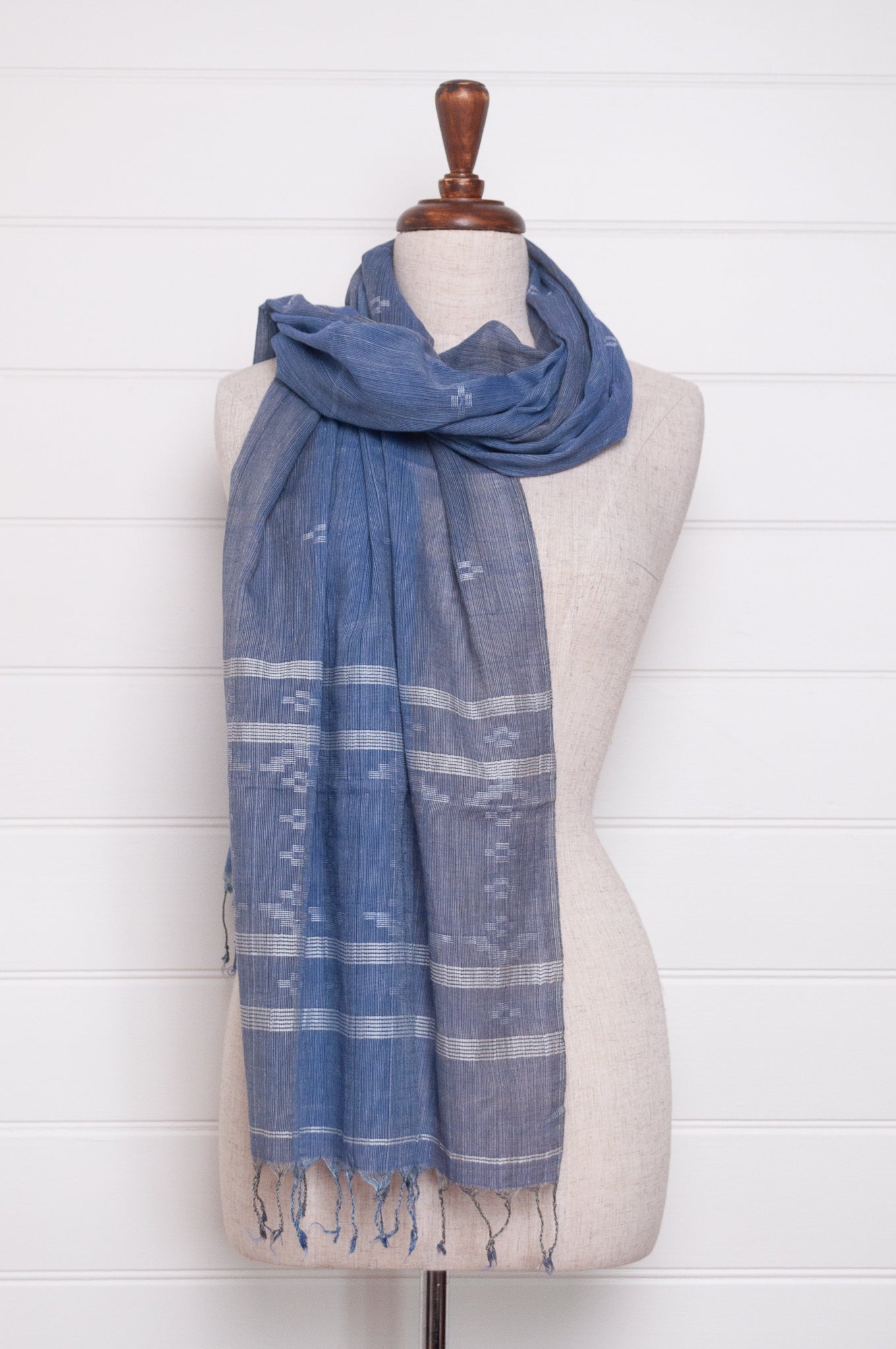 Handwoven light cotton  indigo panelled jamdani scarf with stripes and motifs in white.