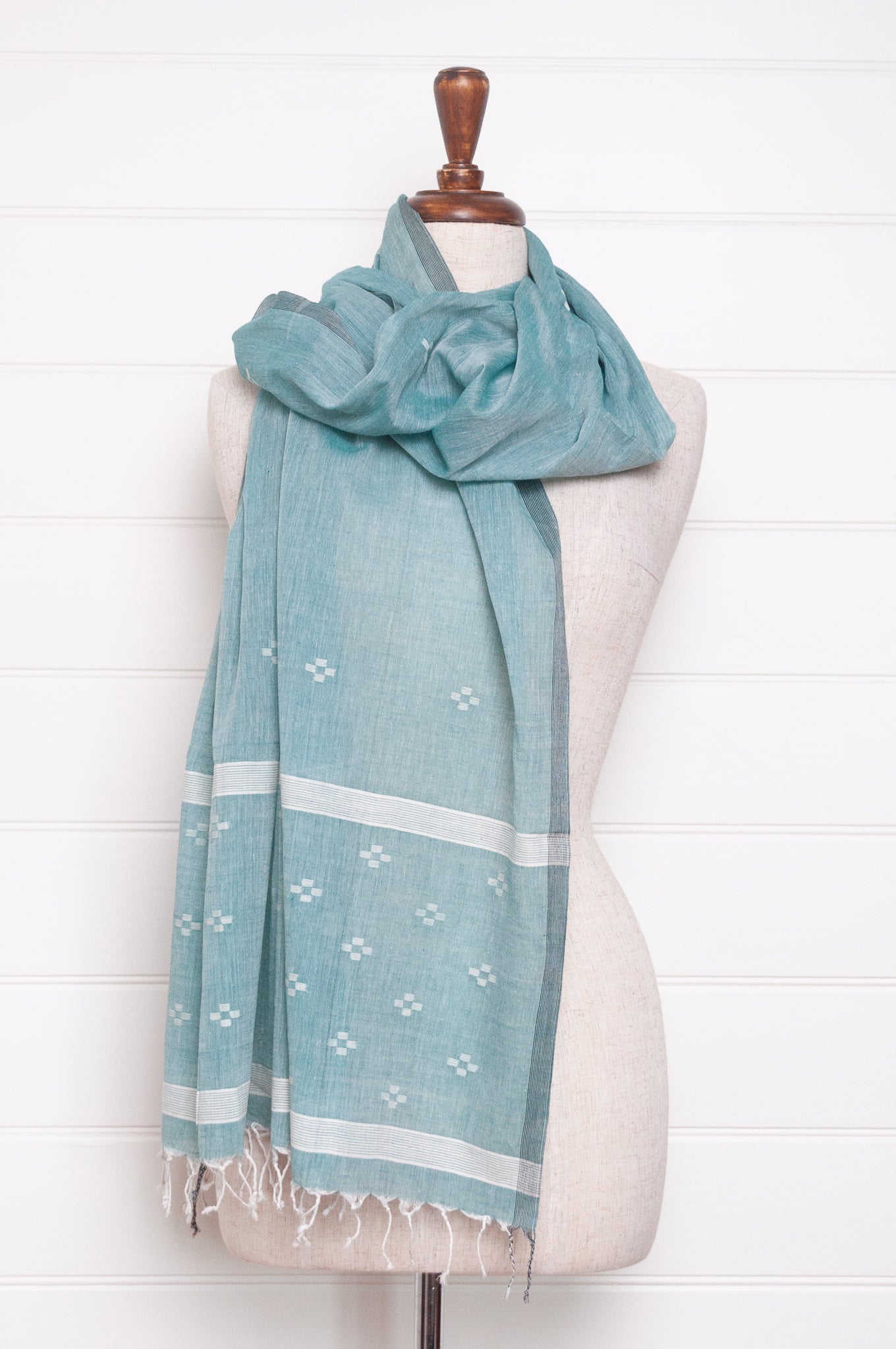 Handwoven light cotton jamdani scarf in light emerald green and white.