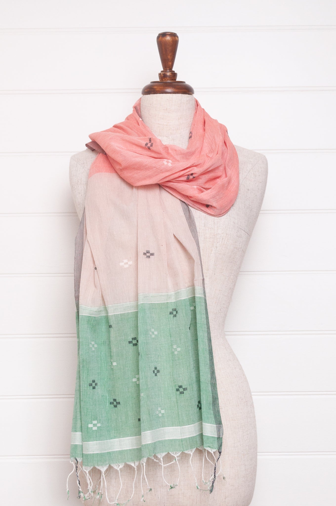 Handwoven light cotton jamdani scarf in light emerald green, coral and white.