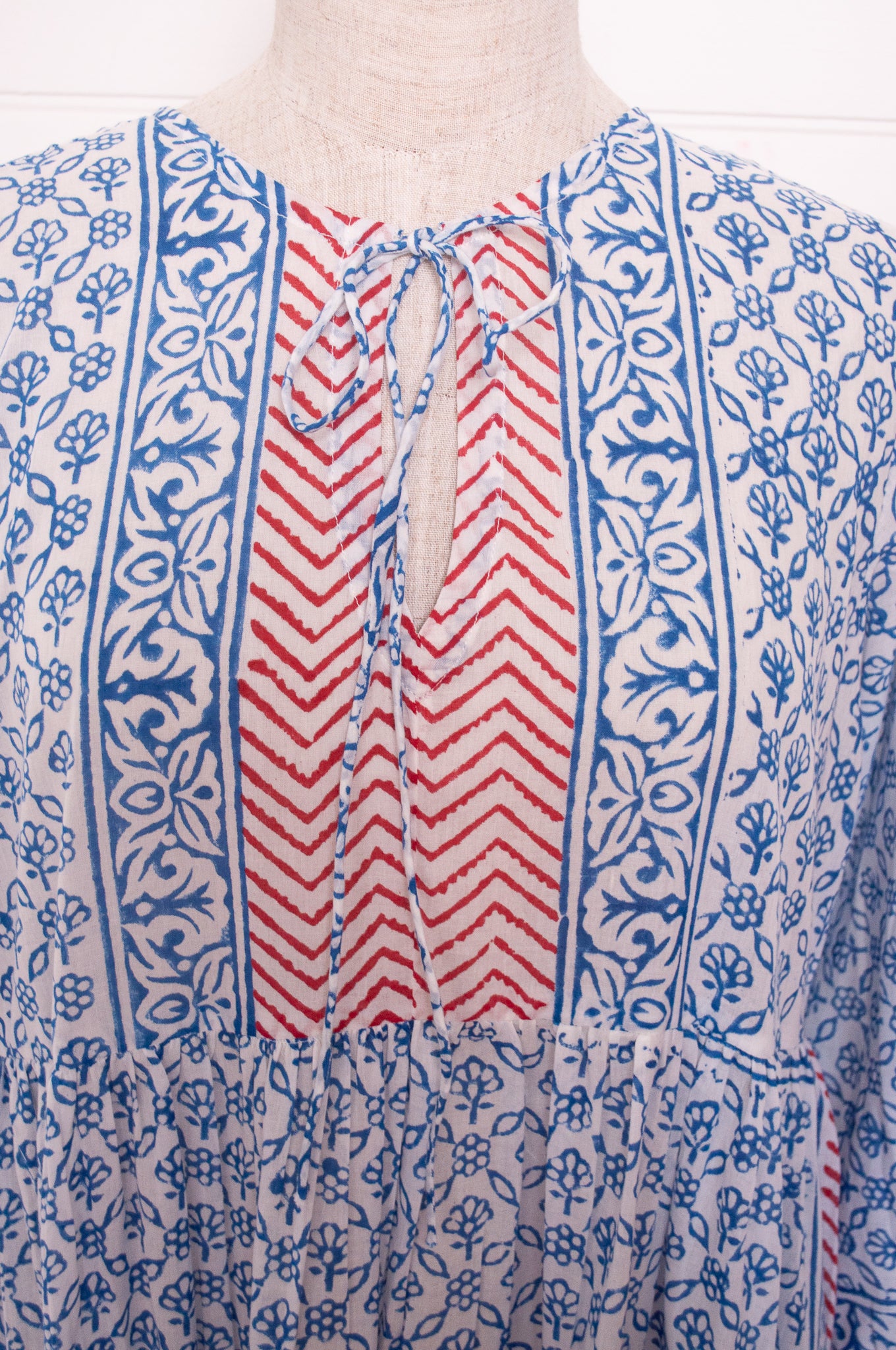 Dora Maxi dress light cotton voile blockprint maxi dress sky blue on white floral with red accents.