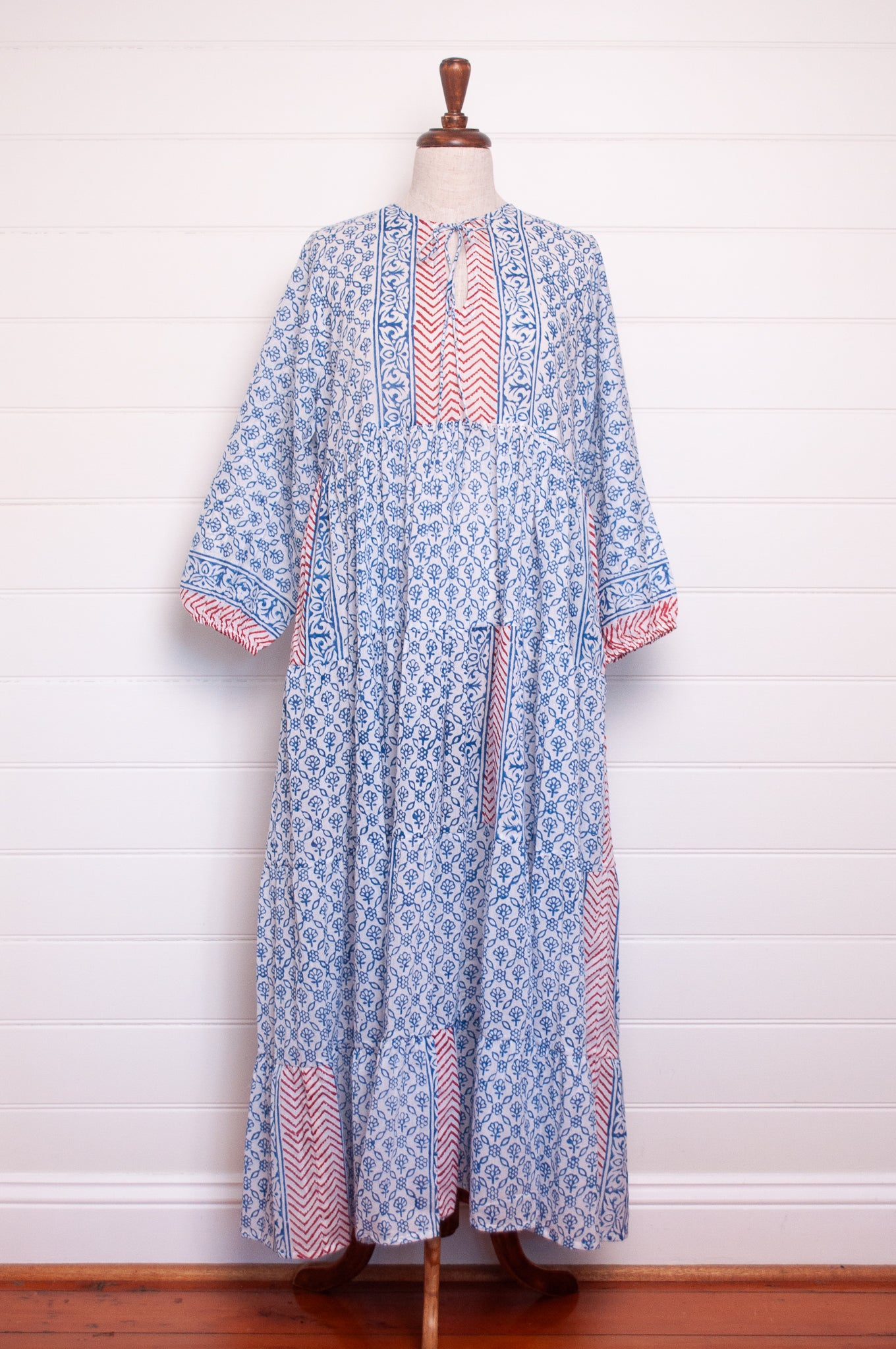 Dora Maxi dress light cotton voile blockprint maxi dress sky blue on white floral with red accents.