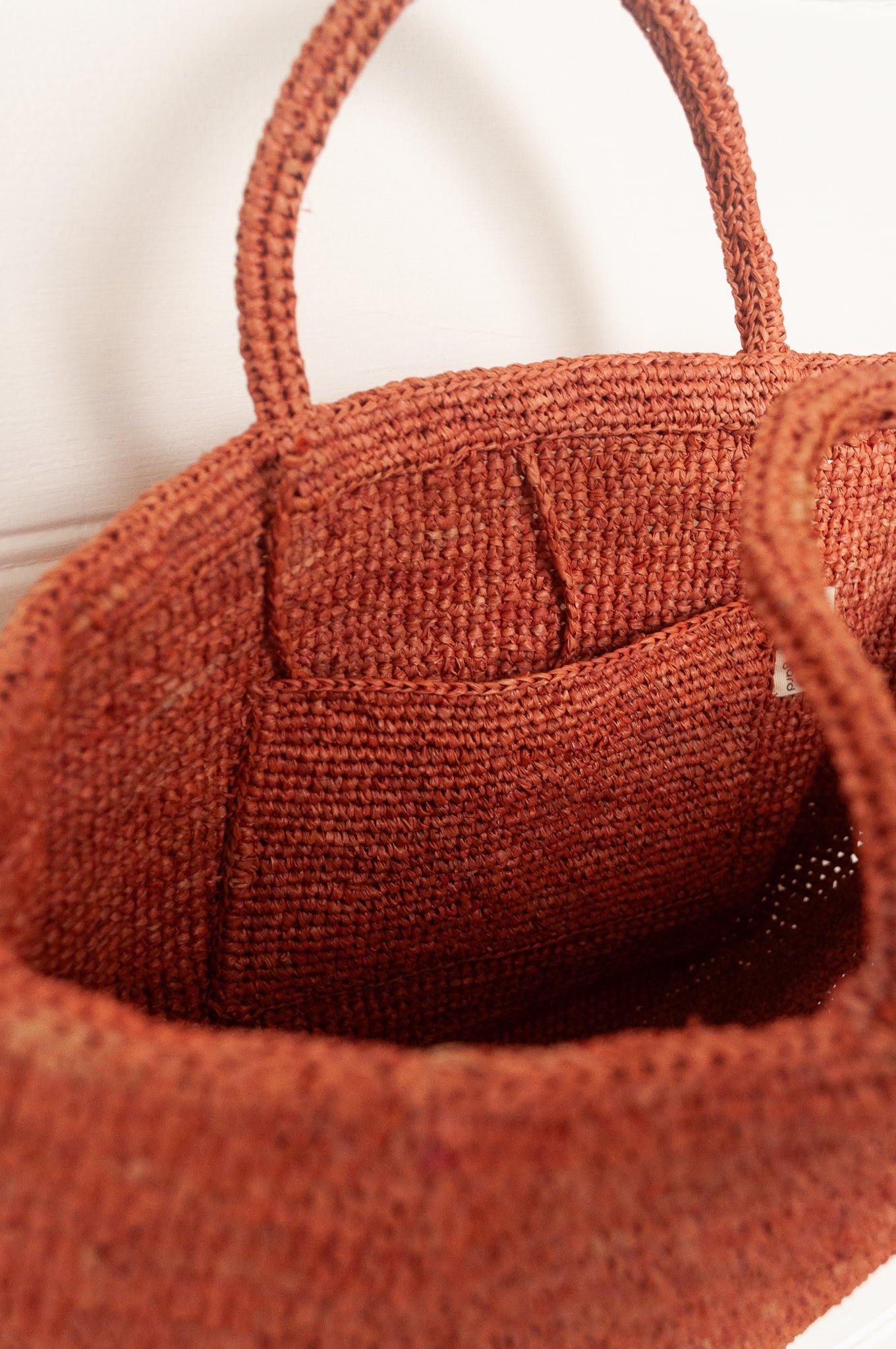 Sophie Digard medium sized crocheted raffia bag in Bois de Rose warm pink.