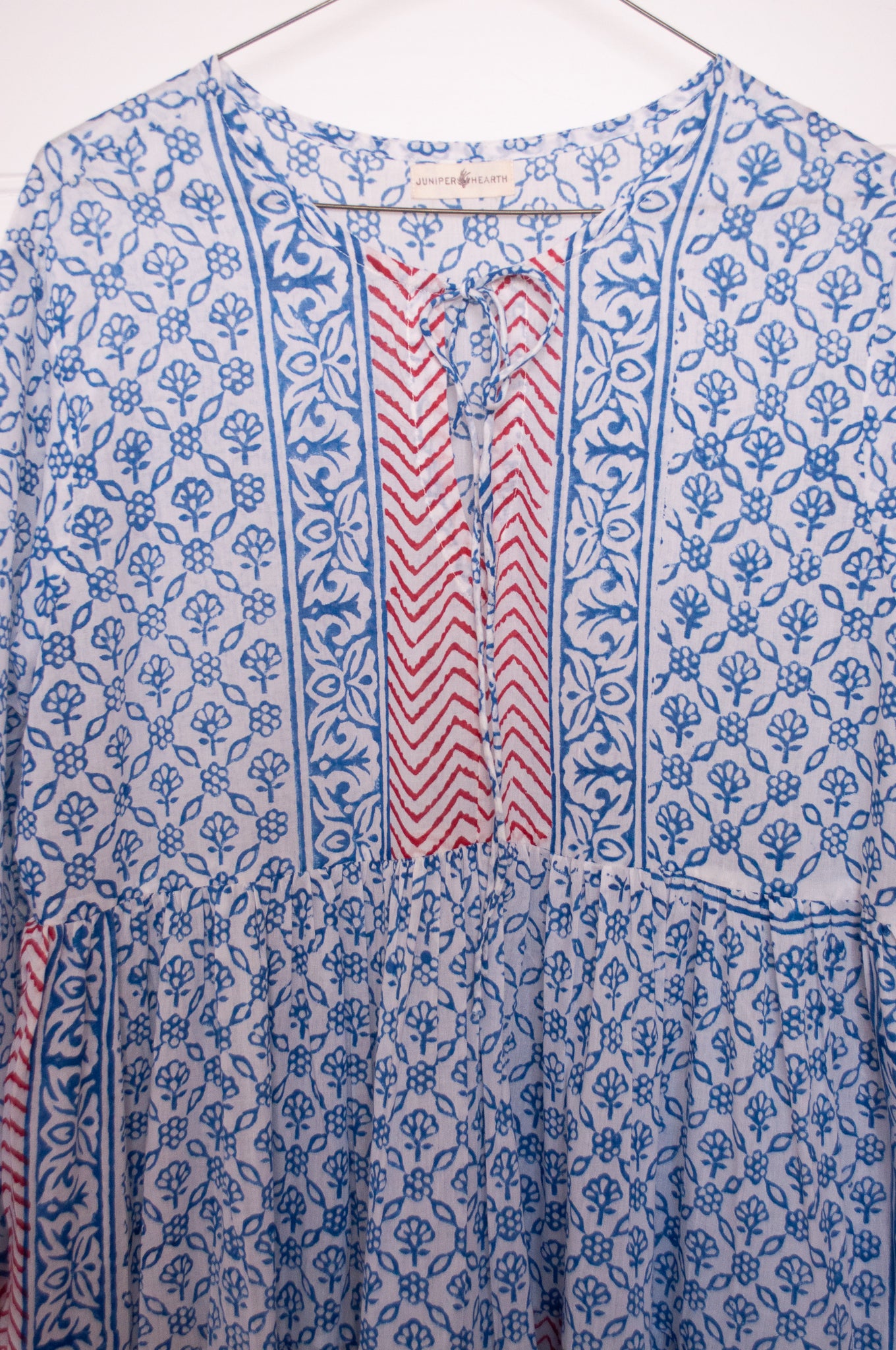 Dora Maxi dress light cotton voile blockprint maxi dress sky blue on white floral with red accents.