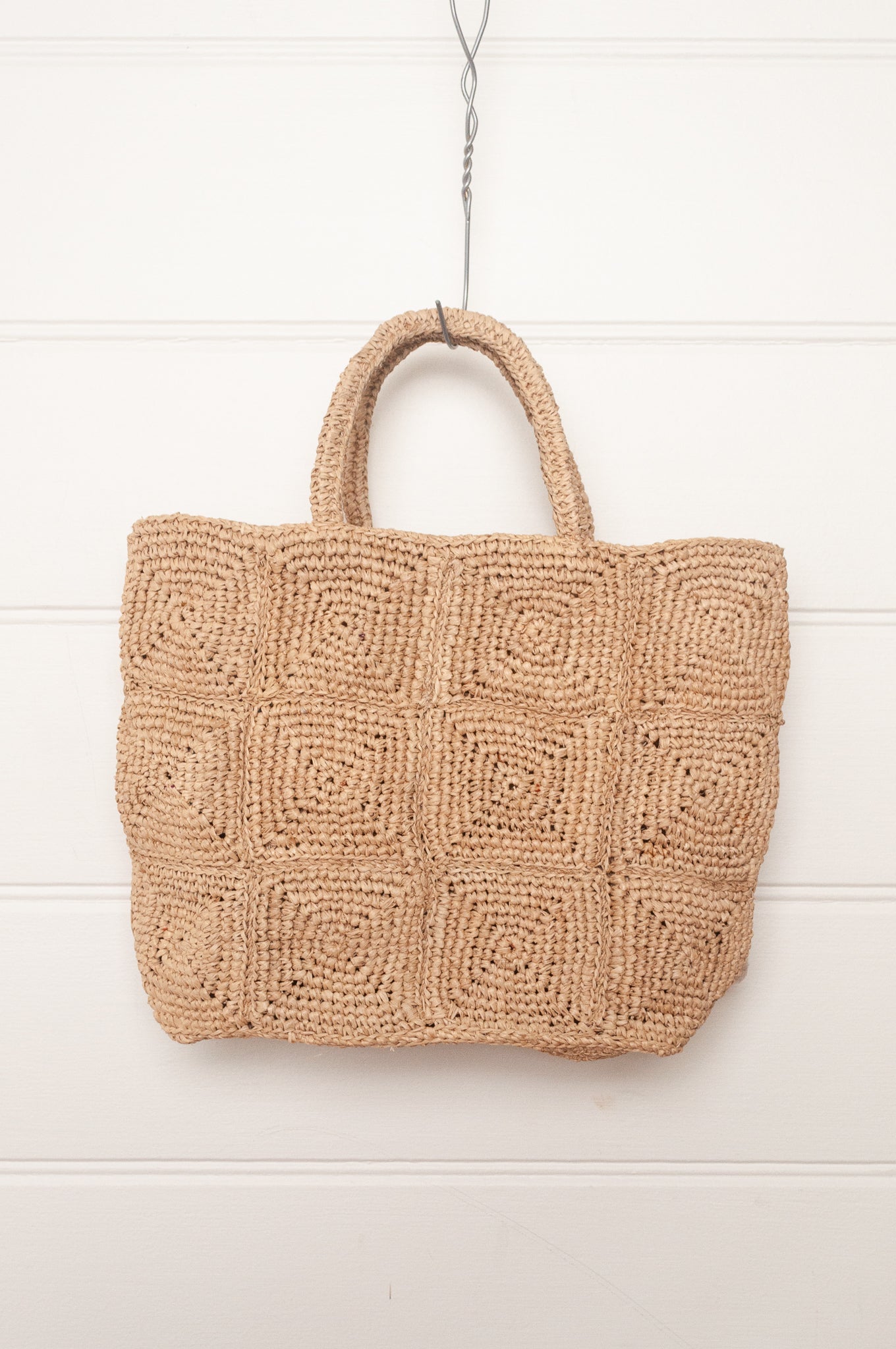 Sophie Digard crochet raffia bag in natural with pastel embroidered velvet flowers.