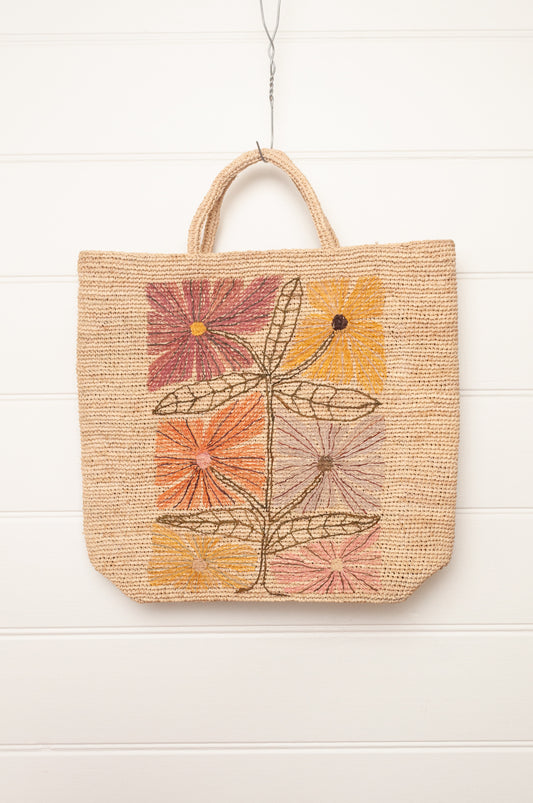 Sophie Digard natural coloured large tote bag with large flowers embroidered in warm neutral tones.