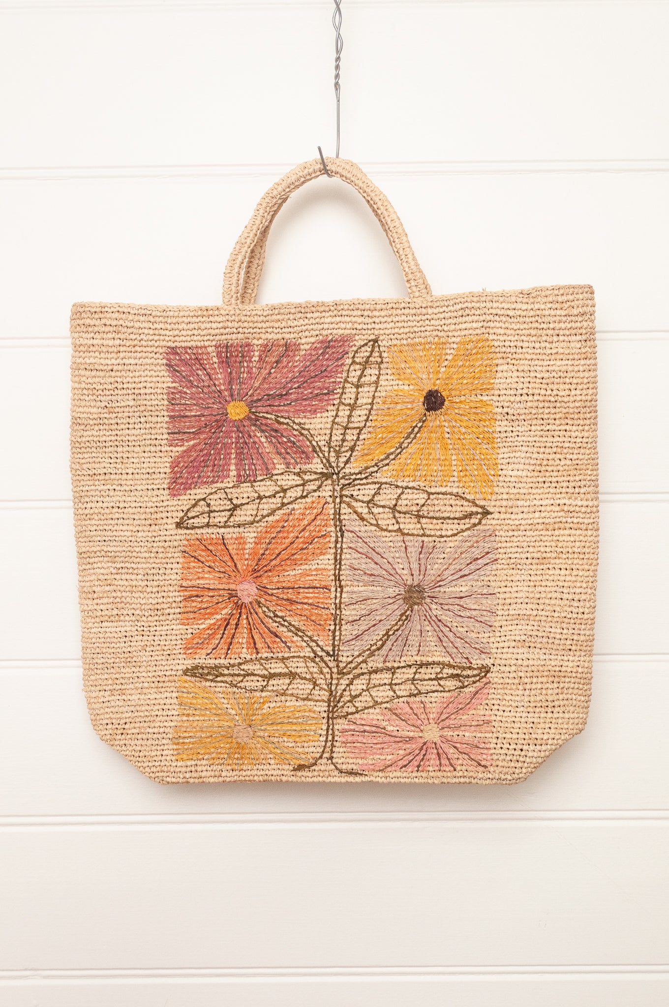 Sophie Digard natural coloured large tote bag with large flowers embroidered in warm neutral tones.