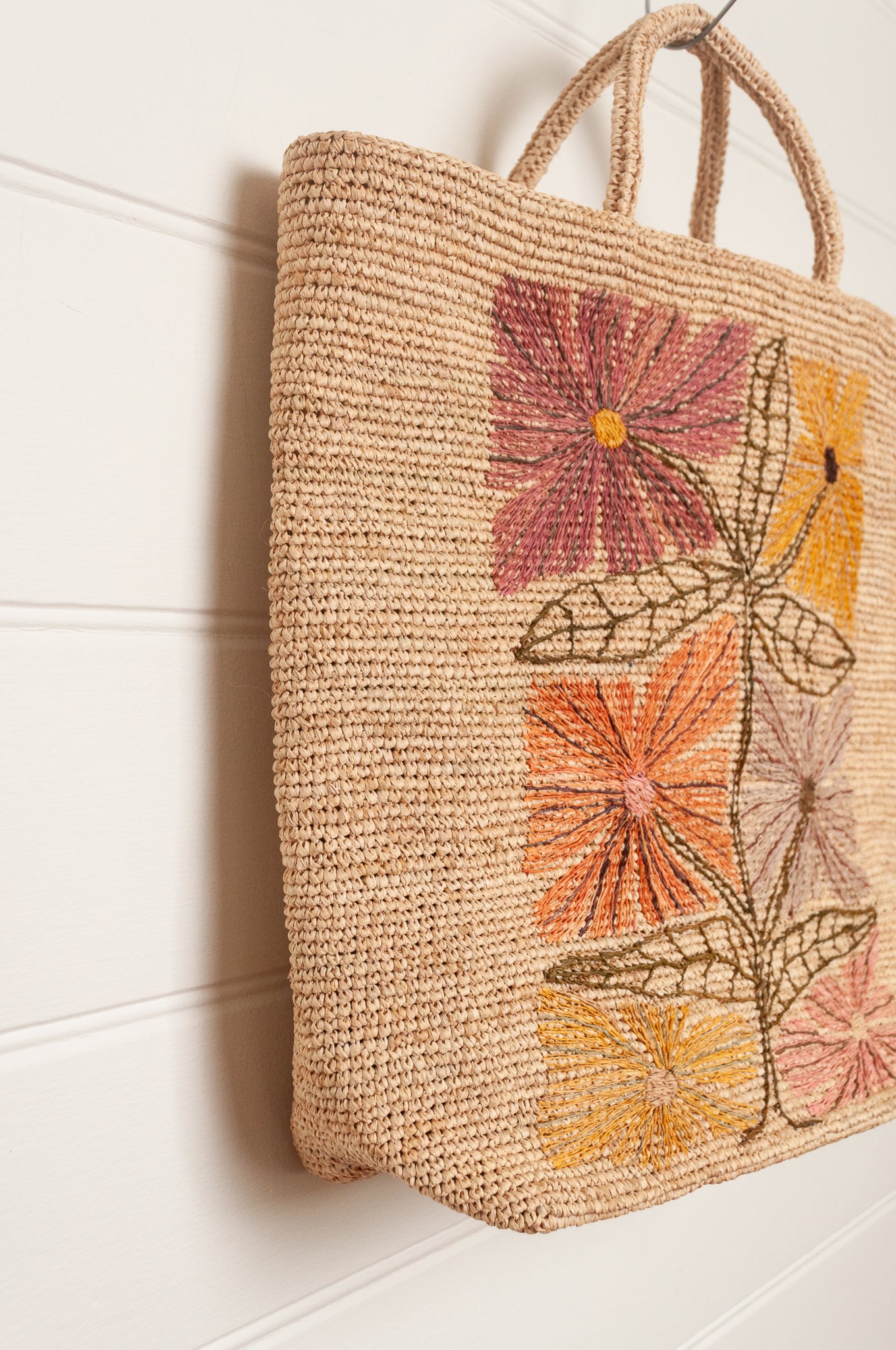 Sophie Digard natural coloured large tote bag with large flowers embroidered in warm neutral tones.