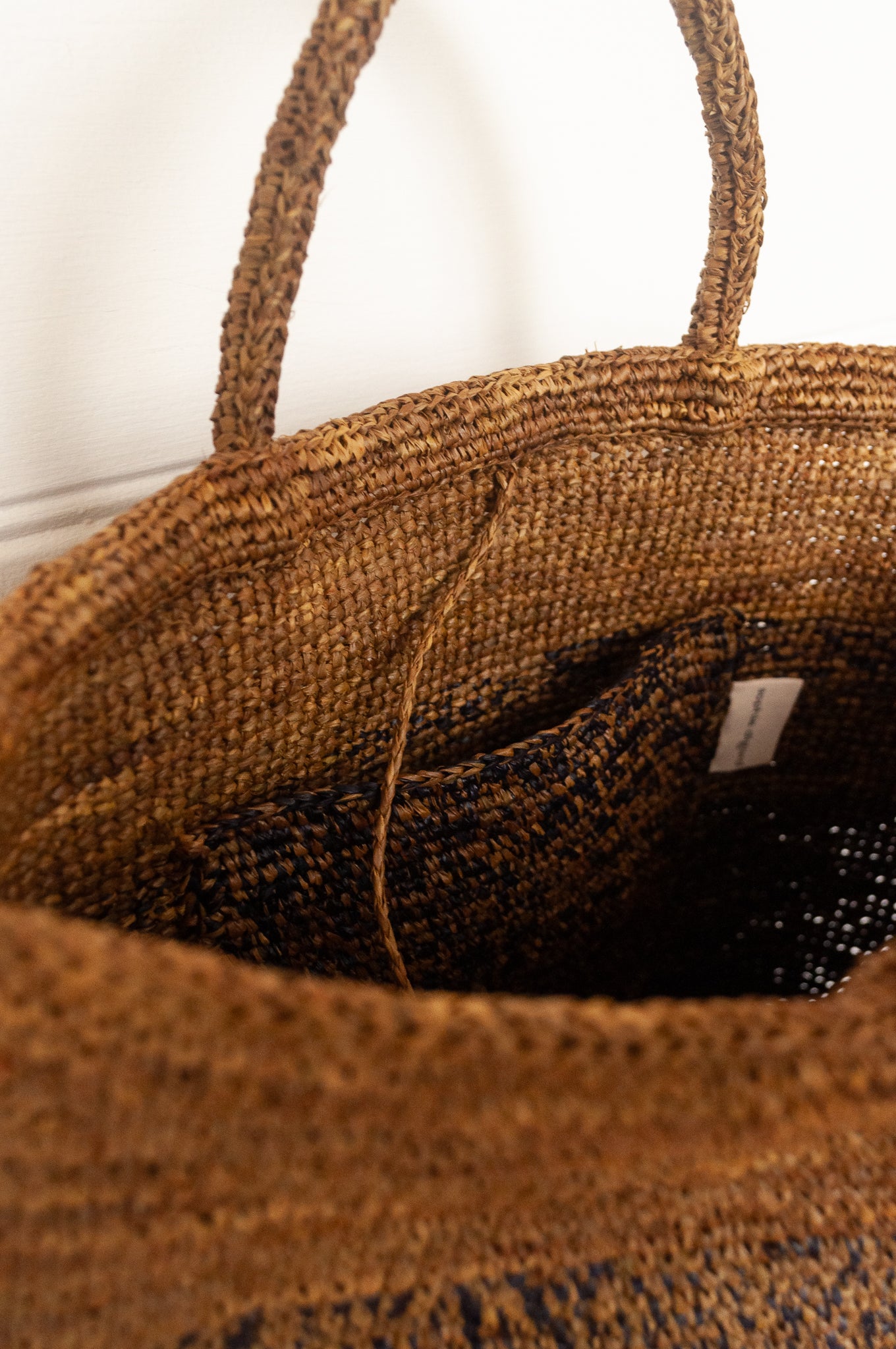 Sophie Digard large raffia tote bag in stripes of charcoal graphite and rich brown.