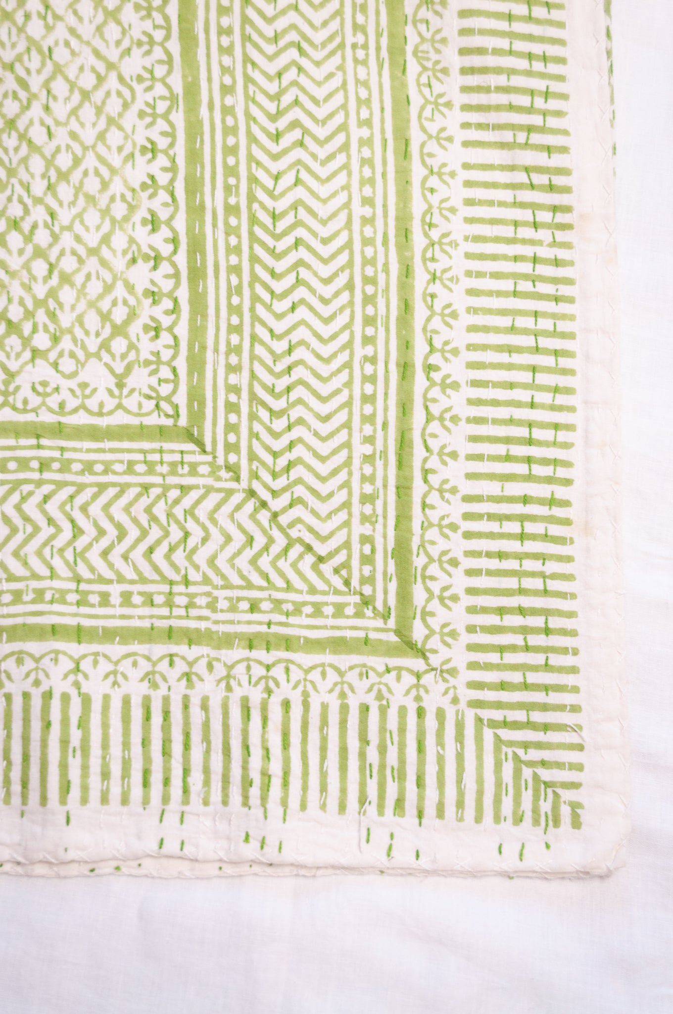 Cotton kantha quilt in lime green and white small floral.