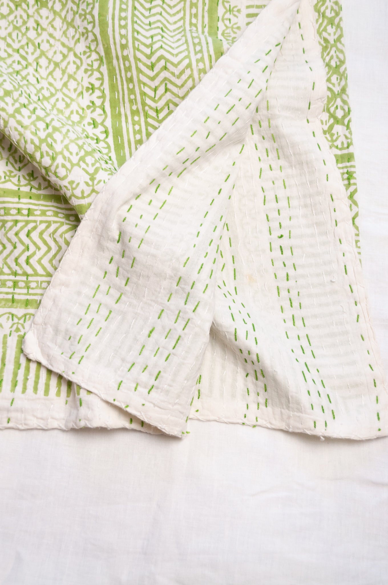 Cotton kantha quilt in lime green and white small floral.