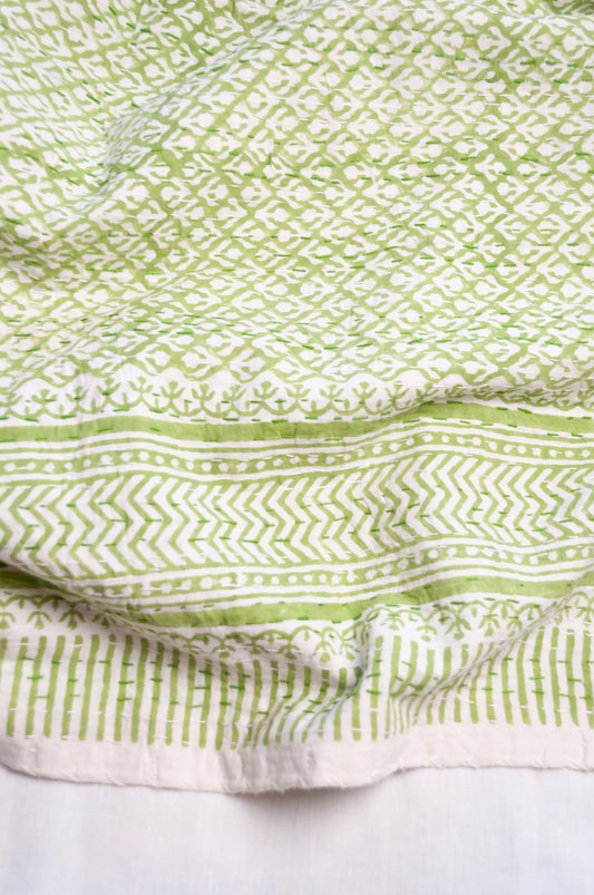 Cotton kantha quilt in lime green and white small floral.
