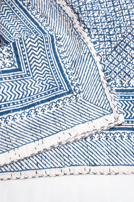Cotton kantha quilt in indigo blue and white small floral.
