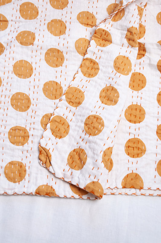 Indigo mustard spot on white cotton kantha quilt.