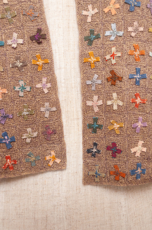 Sophie Digard crochet scarf of multi coloured four petal flowers on nutmeg brown base.