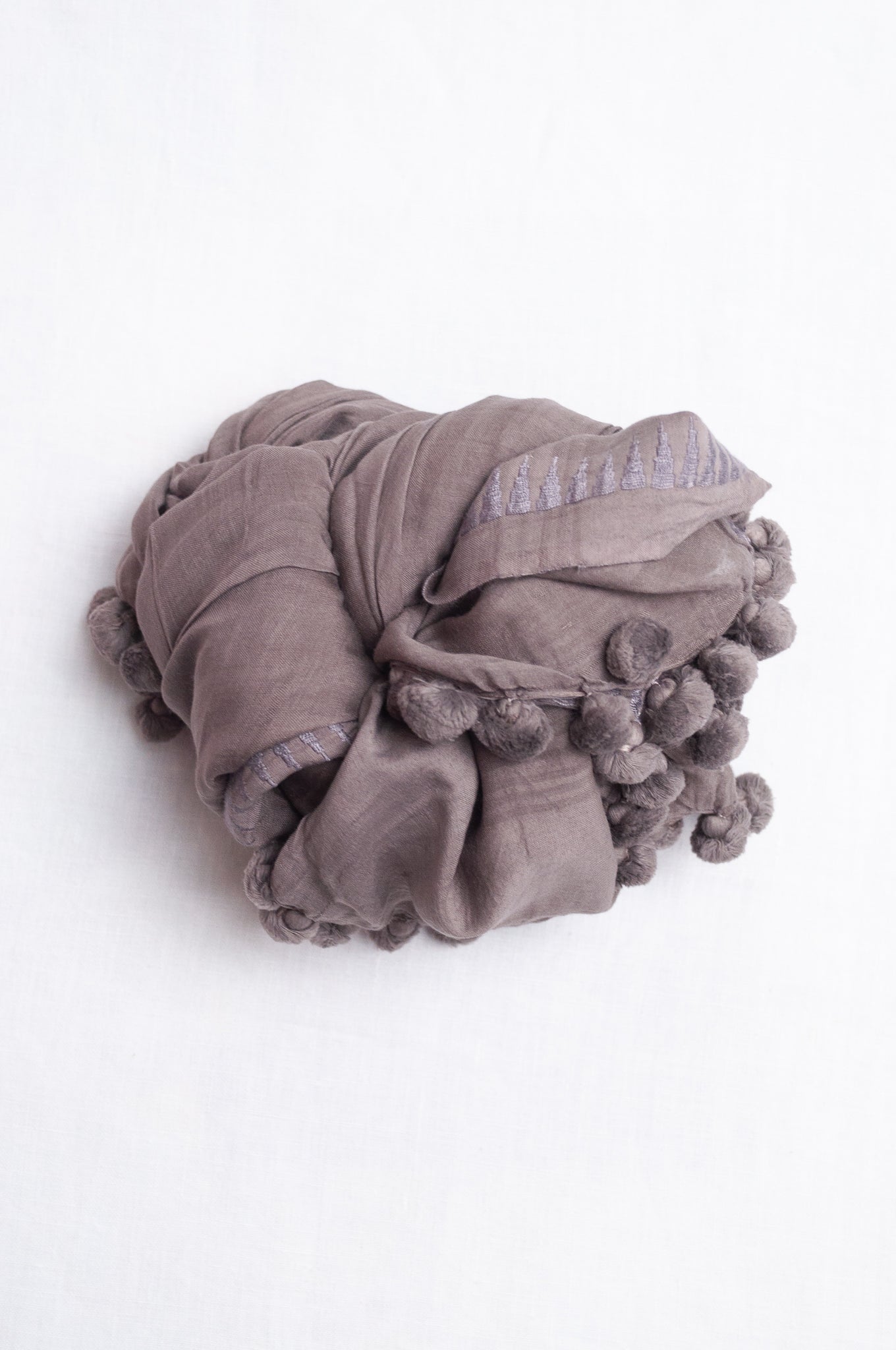 Silk cotton pom pom scarf in storm grey.