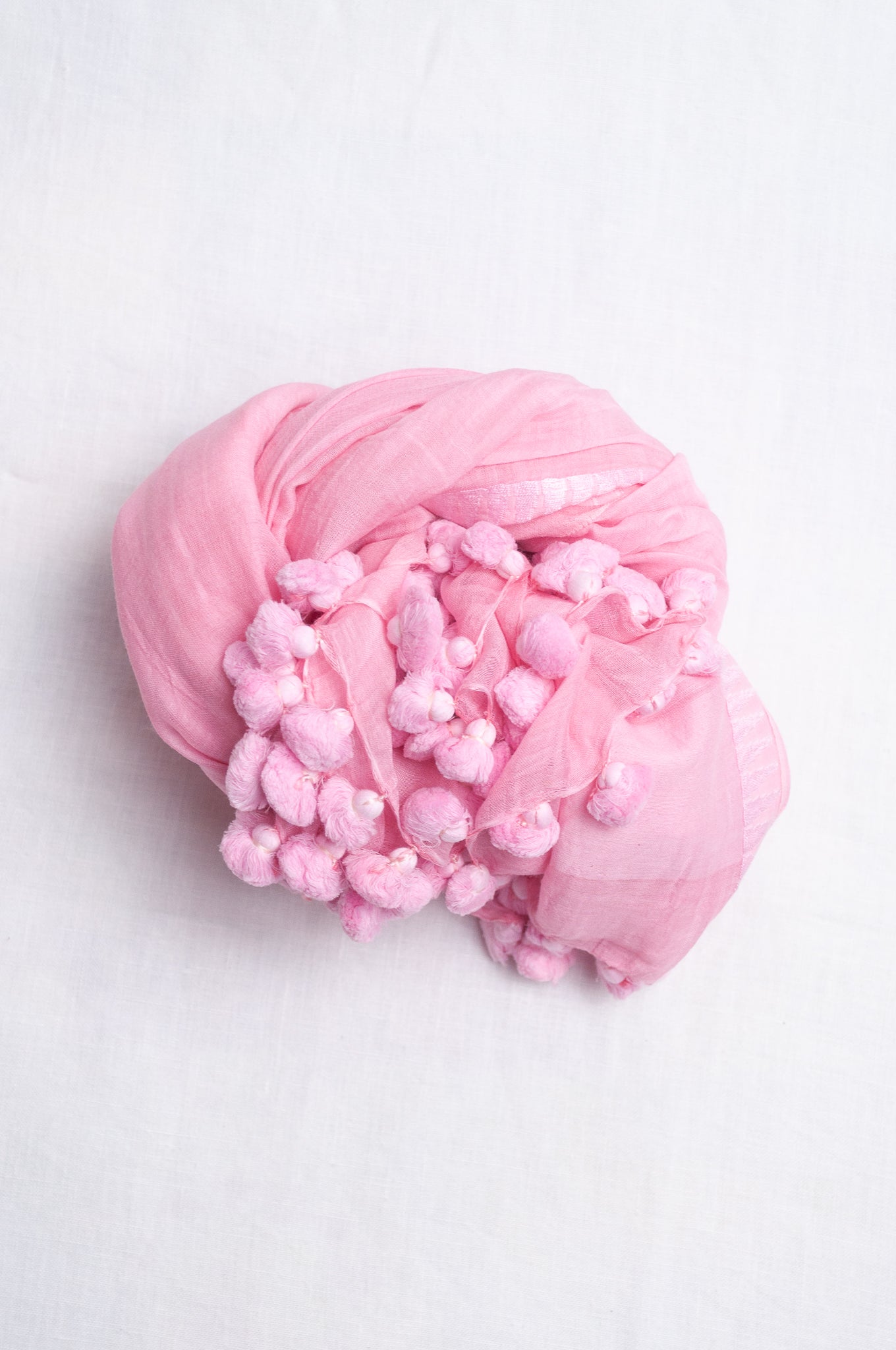 Silk cotton pom pom scarf in petal pink.