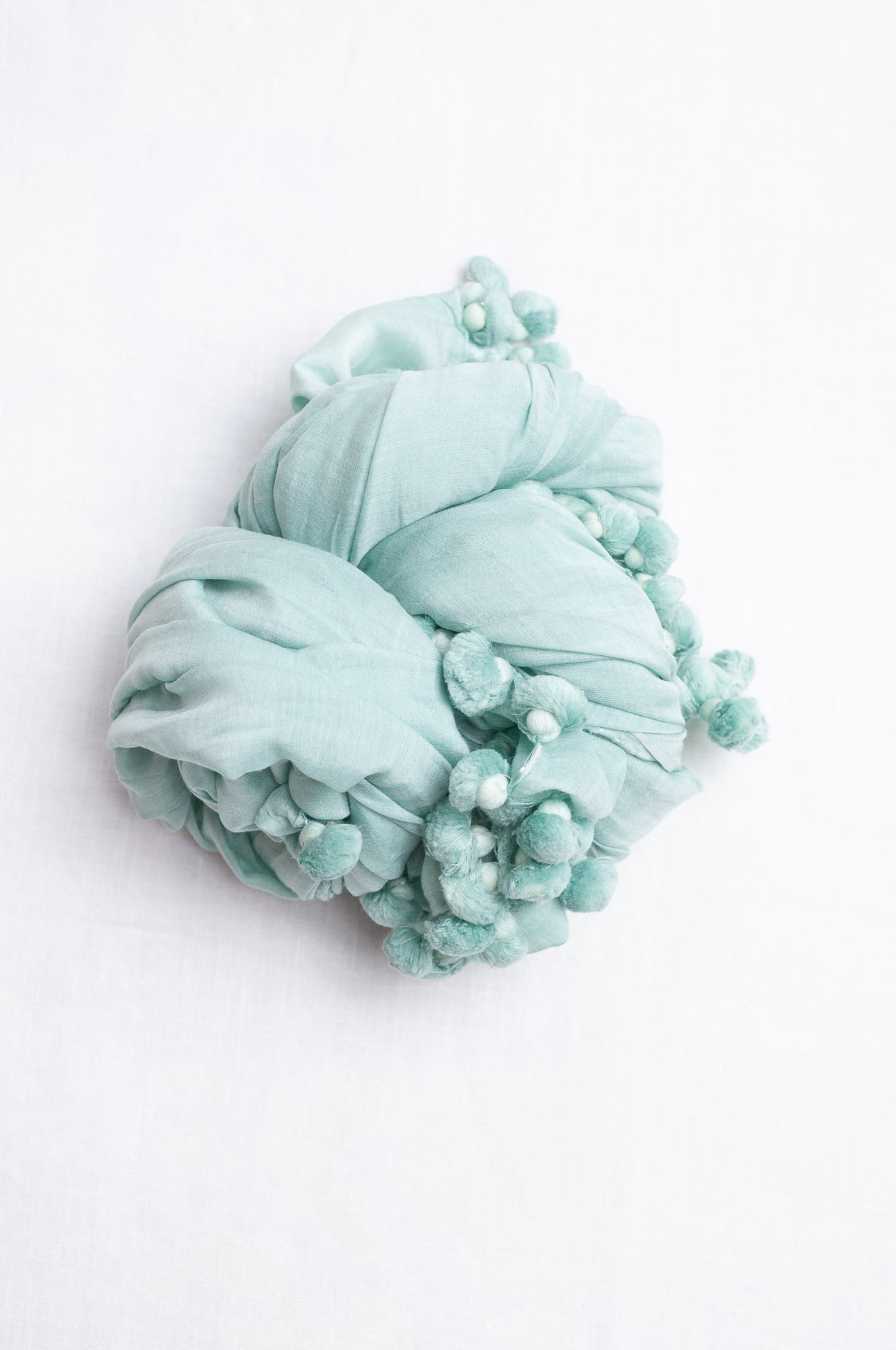 Silk cotton pom pom scarf in aquamarine.