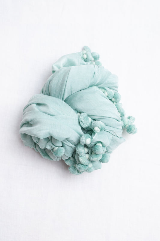 Silk cotton pom pom scarf in aquamarine.