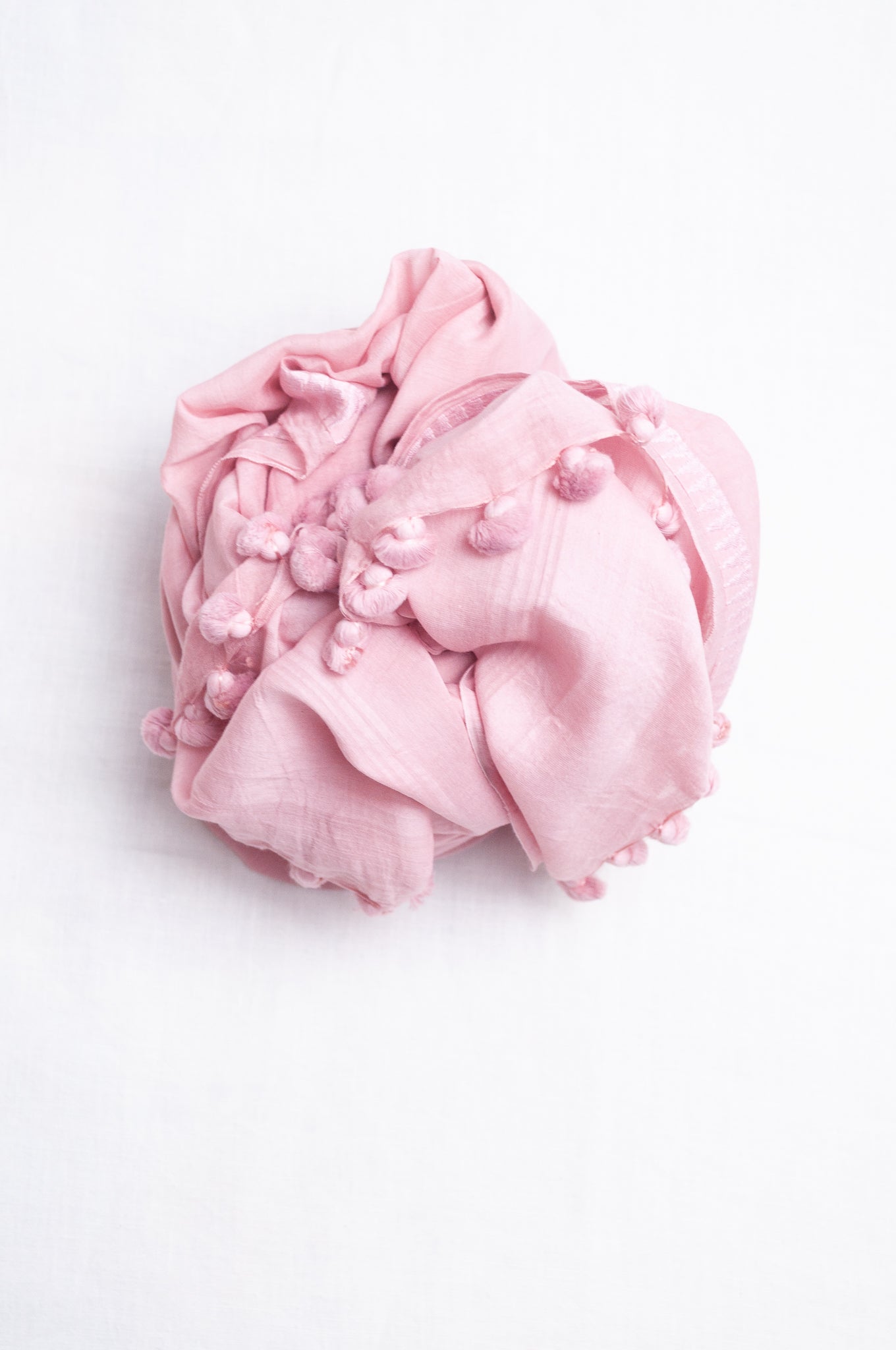 Silk cotton pom pom scarf in lavender pink.