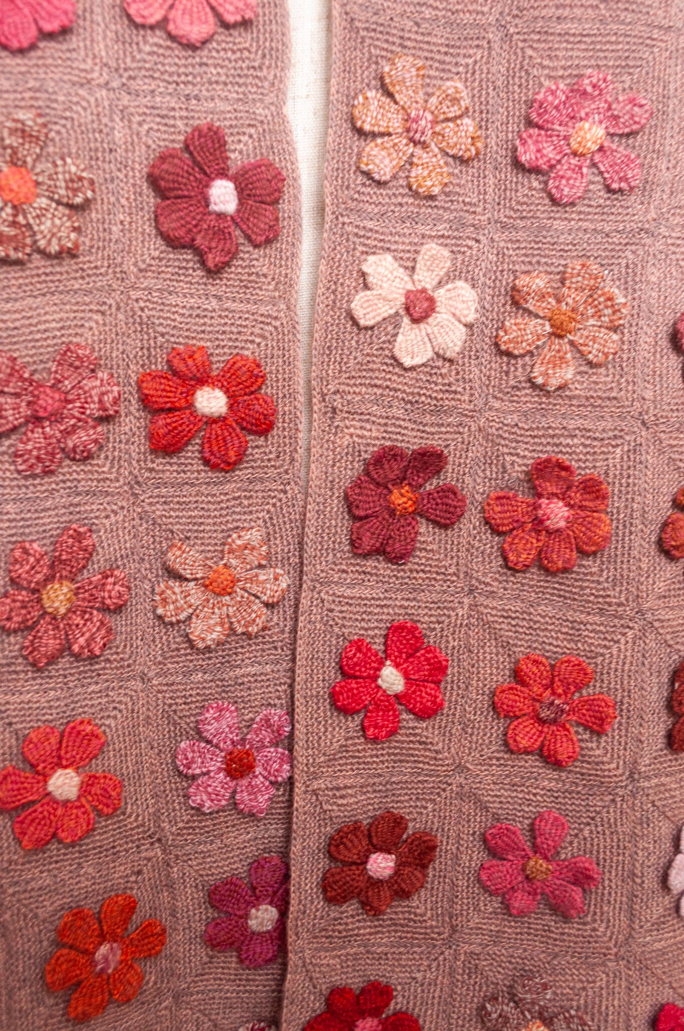 Sophie Digard flower sampler crocheted scarf in pinks and reds on bois de rose base.