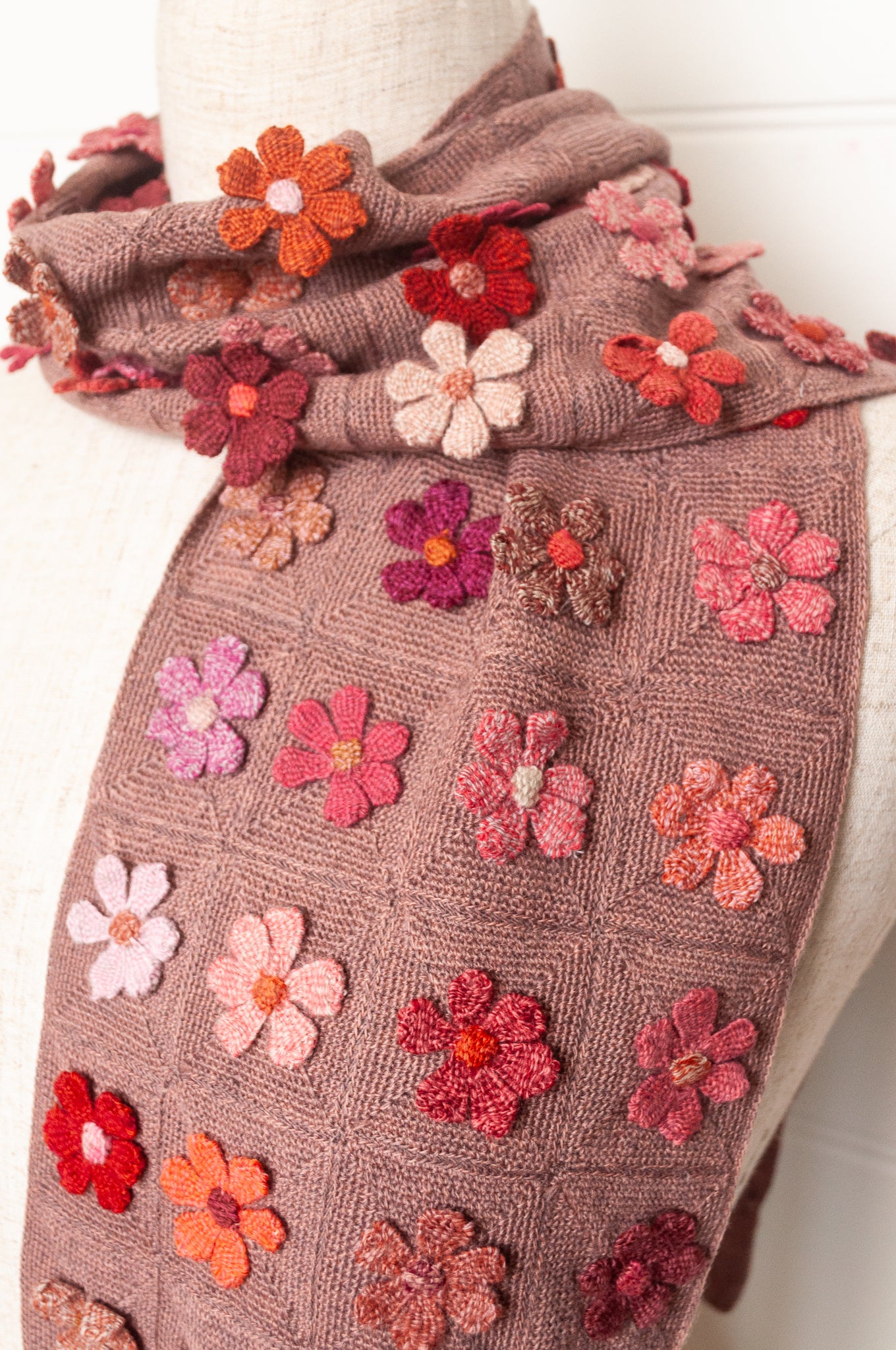 Sophie Digard flower sampler crocheted scarf in pinks and reds on bois de rose base.