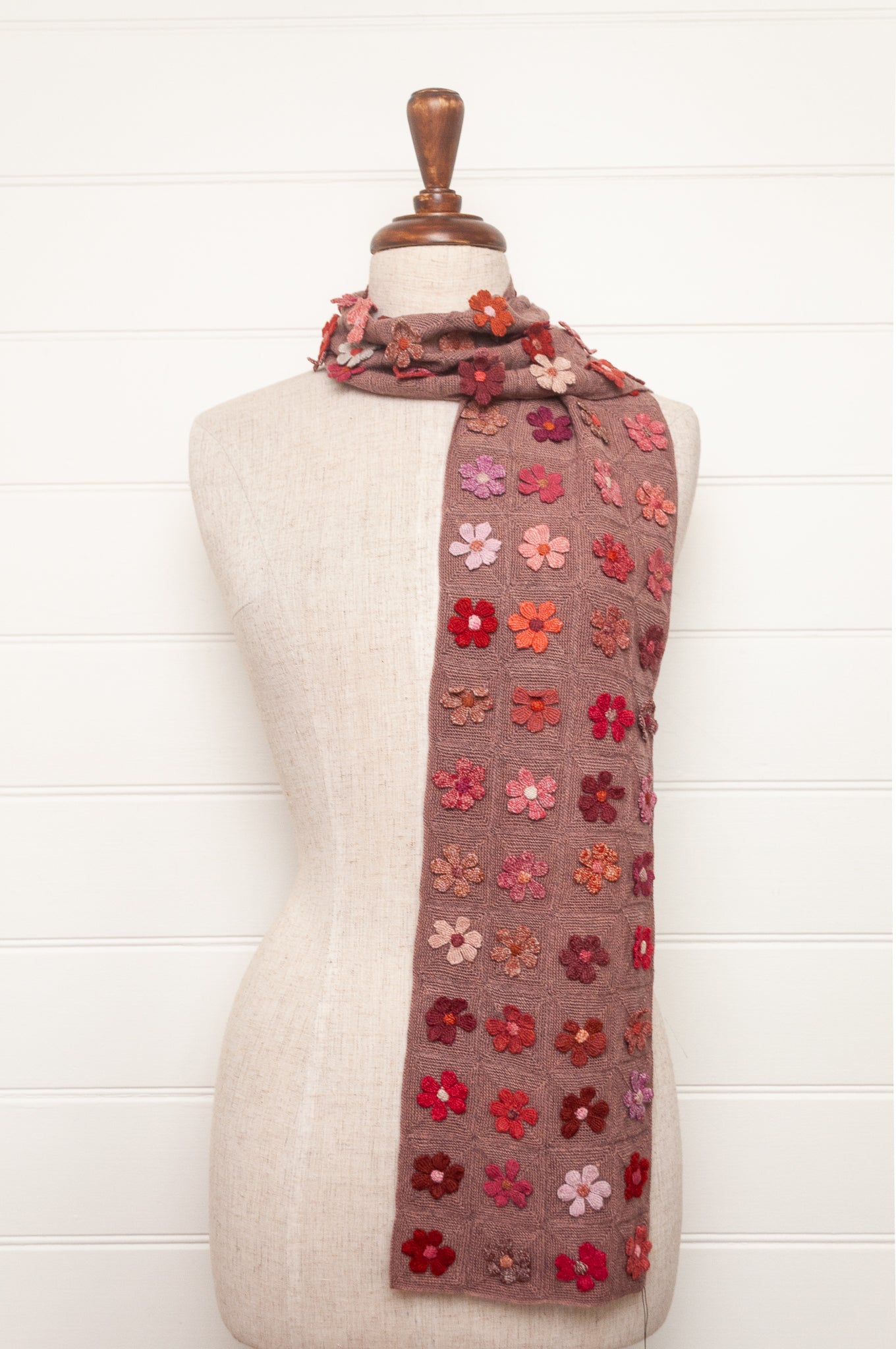 Sophie Digard flower sampler crocheted scarf in pinks and reds on bois de rose base.