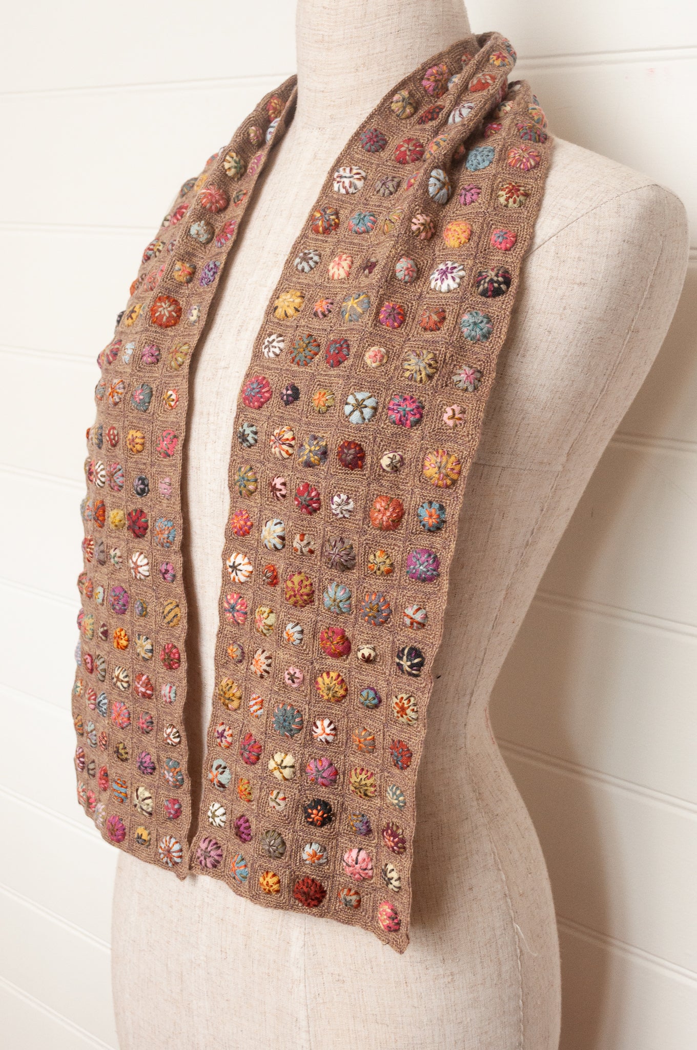 Sophie Digard  crocheted scarf of squares in nutmeg brown with multi-coloured embroidered fabric buttons.