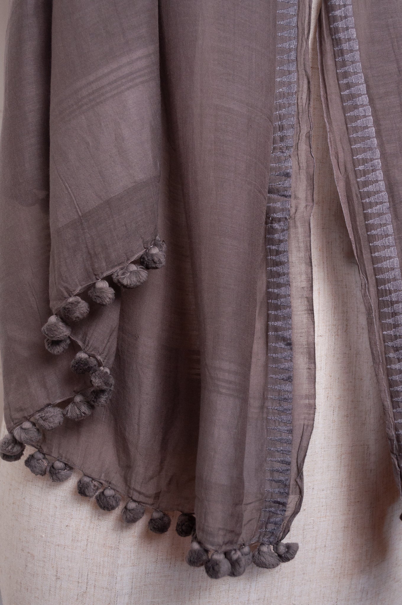 Silk cotton pom pom scarf in storm grey.