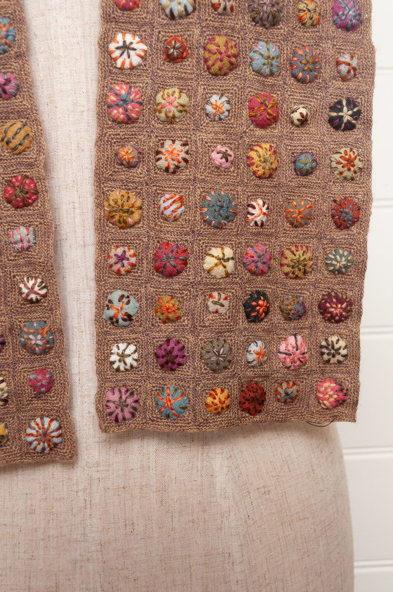 Sophie Digard  crocheted scarf of squares in nutmeg brown with multi-coloured embroidered fabric buttons.