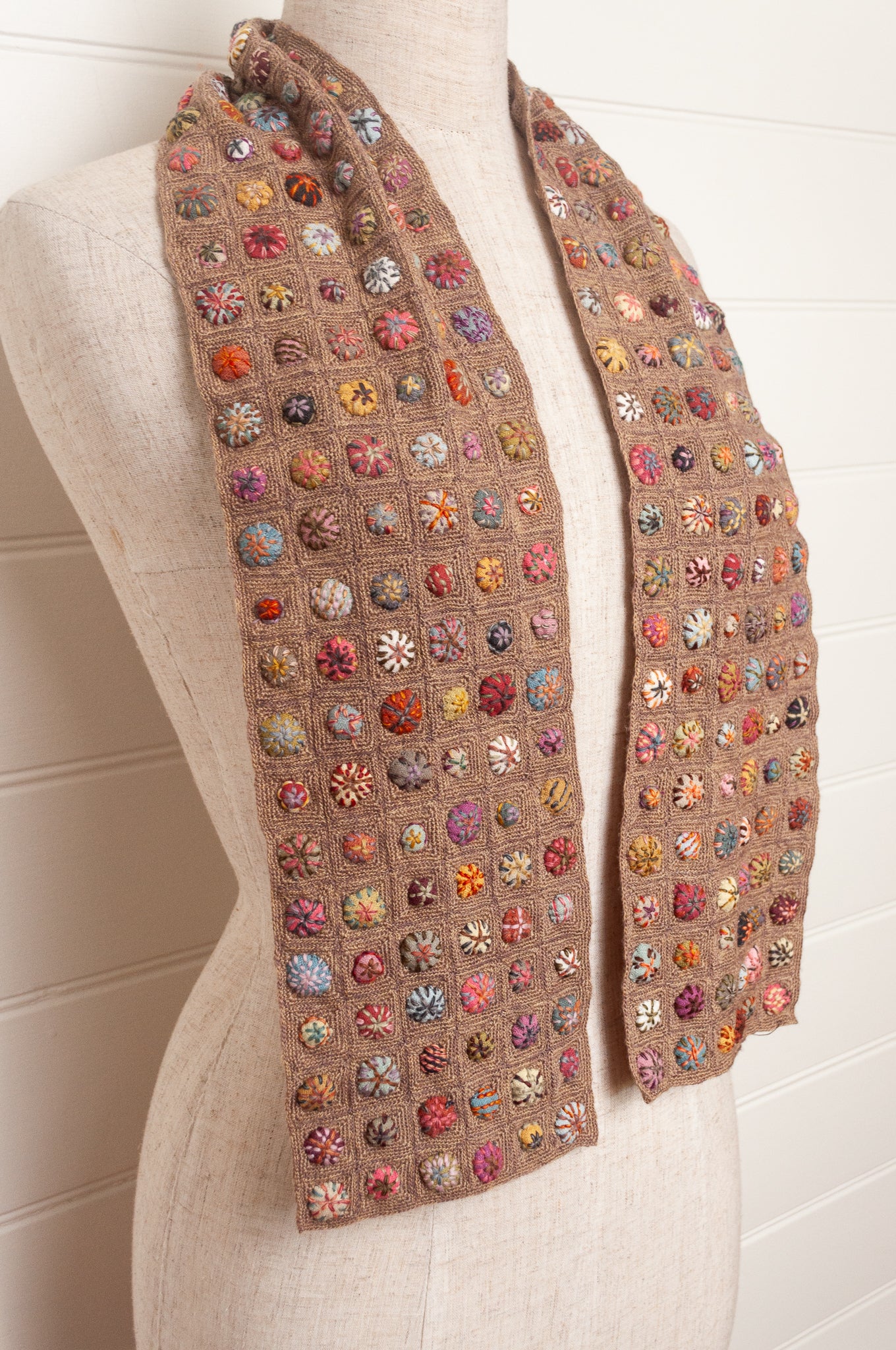 Sophie Digard  crocheted scarf of squares in nutmeg brown with multi-coloured embroidered fabric buttons.