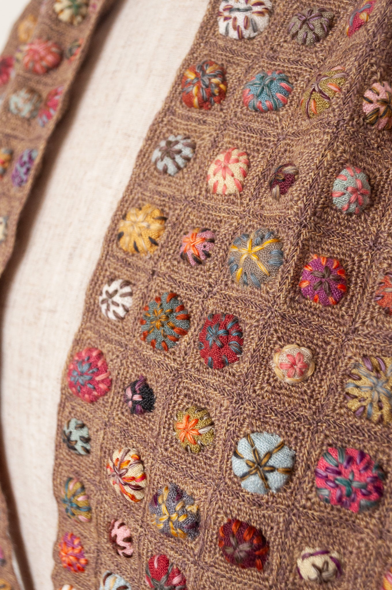Sophie Digard  crocheted scarf of squares in nutmeg brown with multi-coloured embroidered fabric buttons.