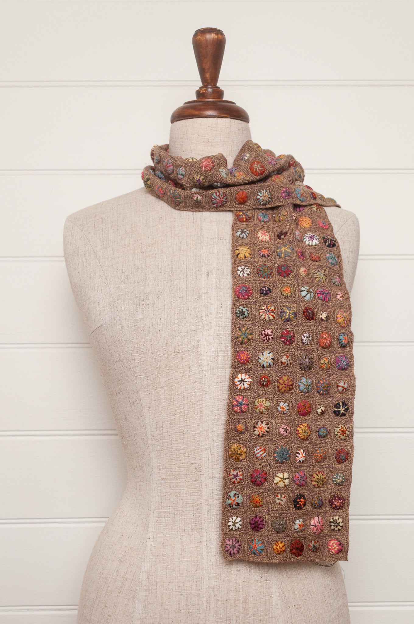 Sophie Digard  crocheted scarf of squares in nutmeg brown with multi-coloured embroidered fabric buttons.