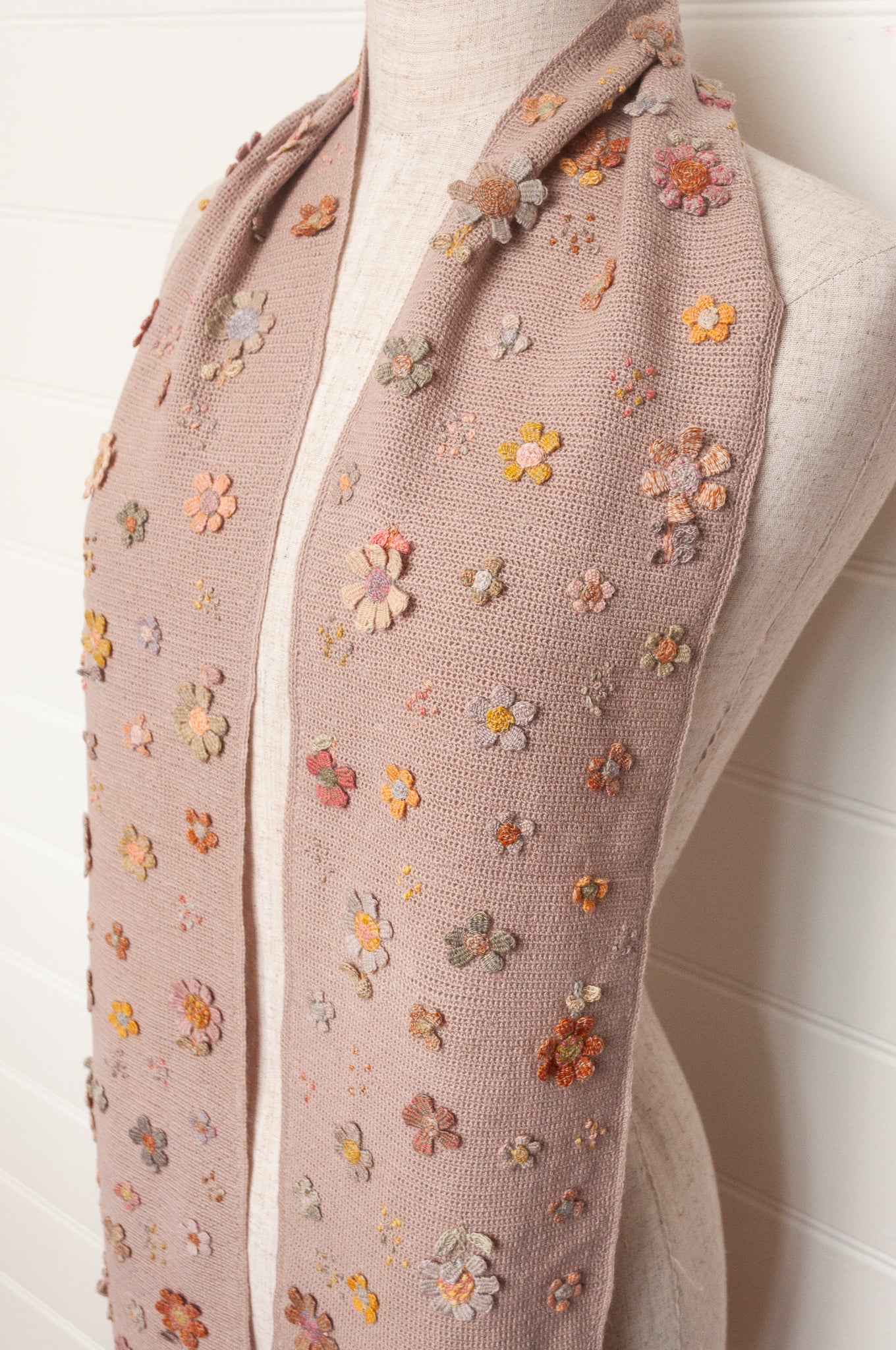 Sophie Digard flower sampler crocheted scarf in soft pastel palette on lilac base.