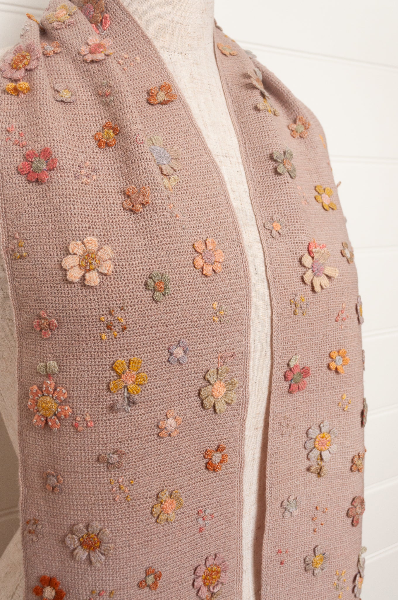 Sophie Digard flower sampler crocheted scarf in soft pastel palette on lilac base.
