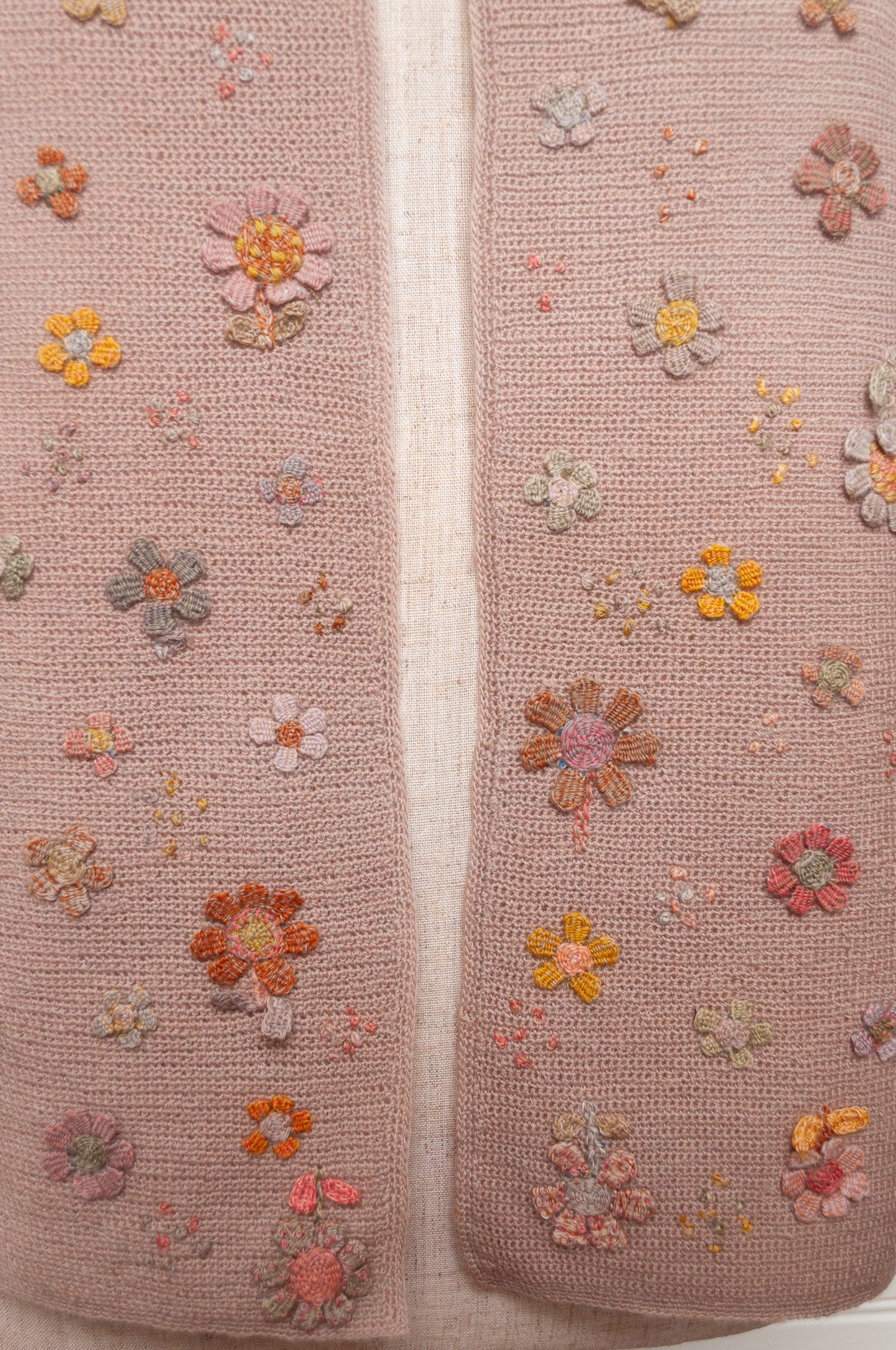 Sophie Digard flower sampler crocheted scarf in soft pastel palette on lilac base.